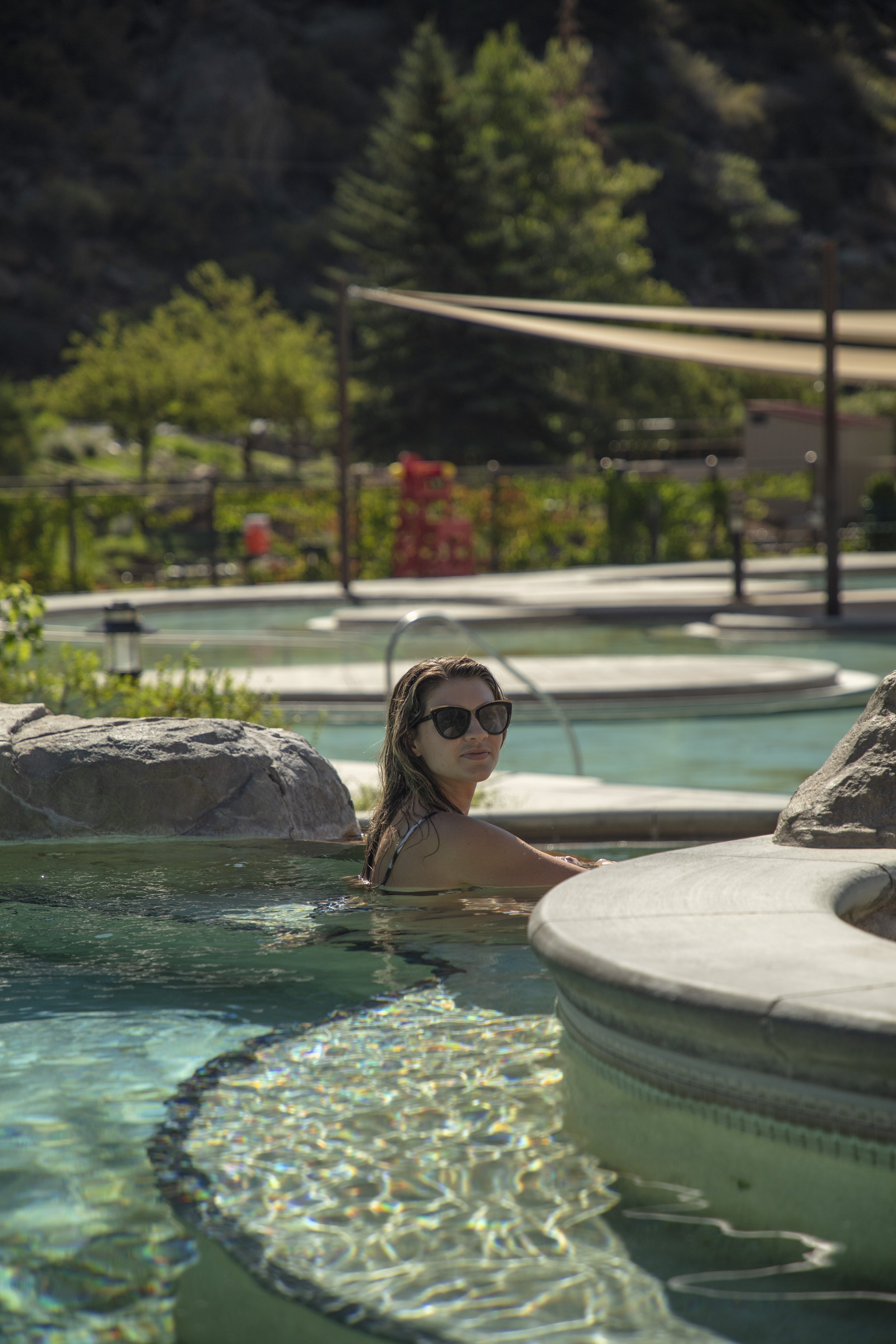 Woman sitting in Ouray Hot Springs Pool