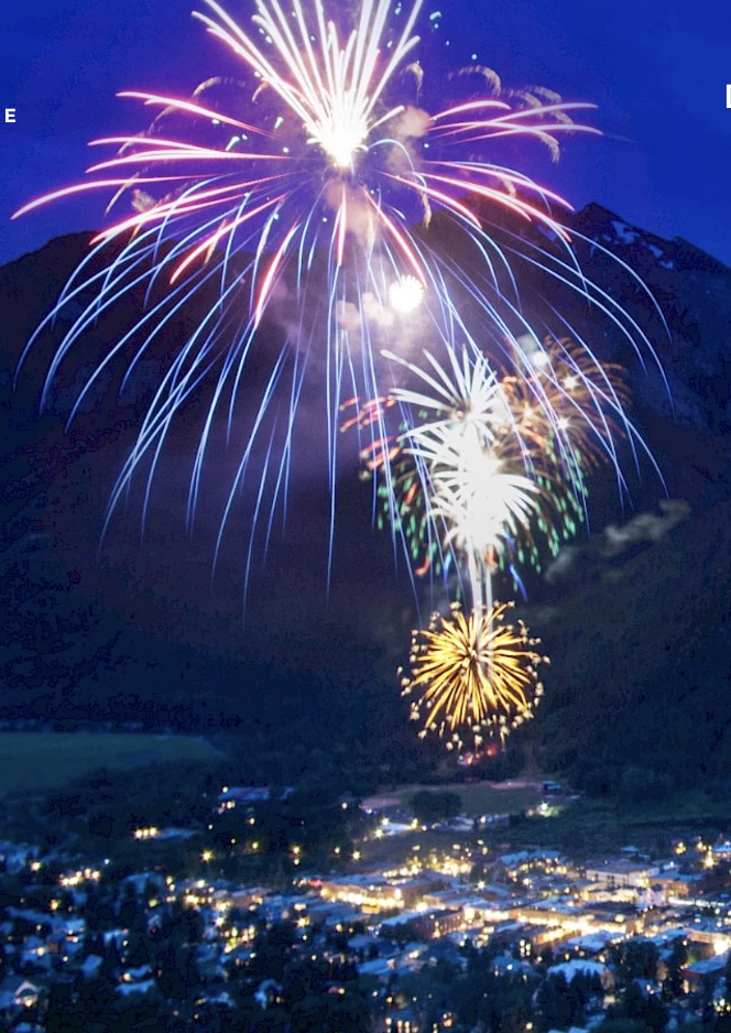 Fire works popping off in mountain valley