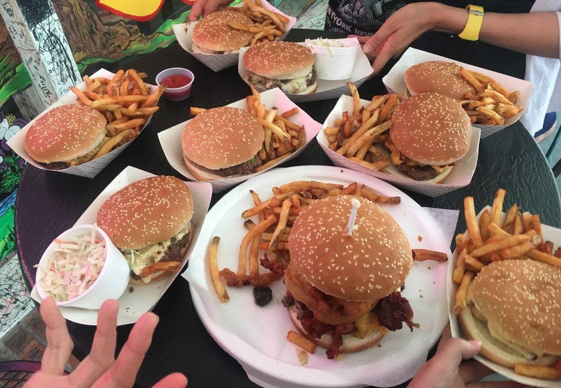 9 trays with burgers and sides