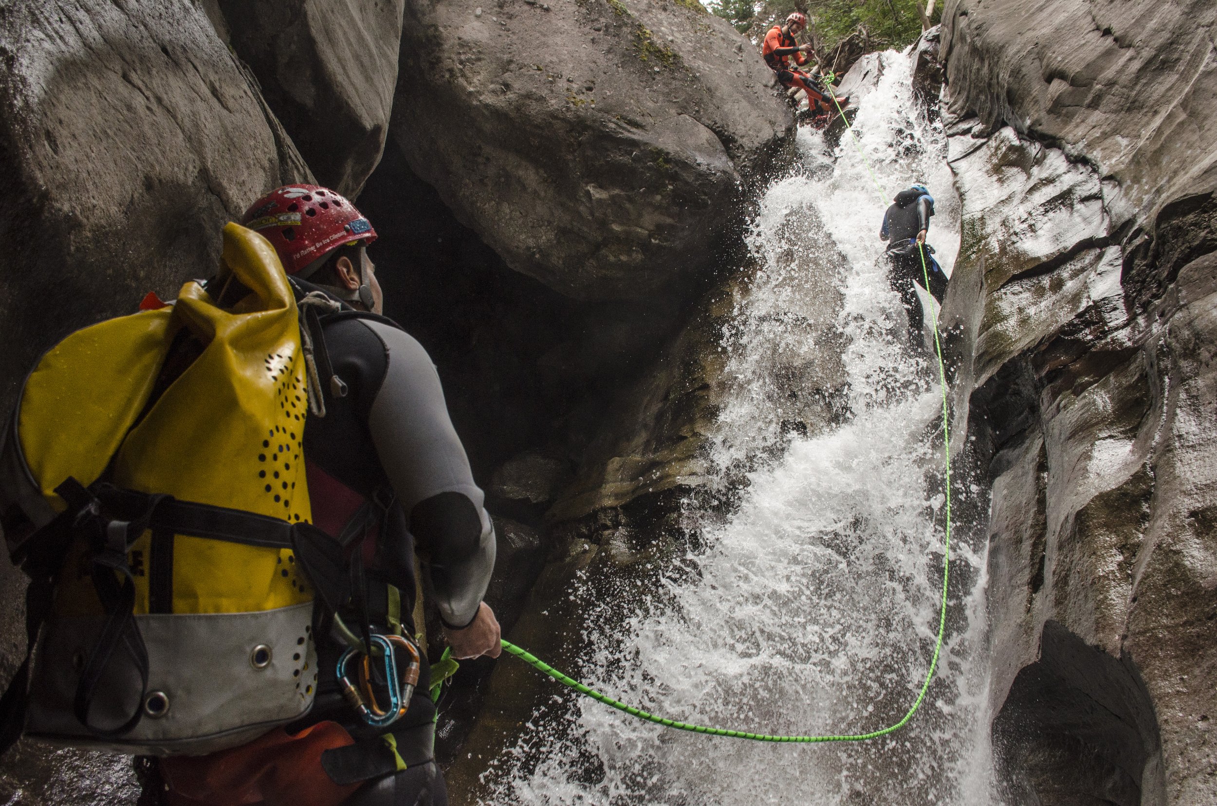 People repelling down waterfall in Ouray