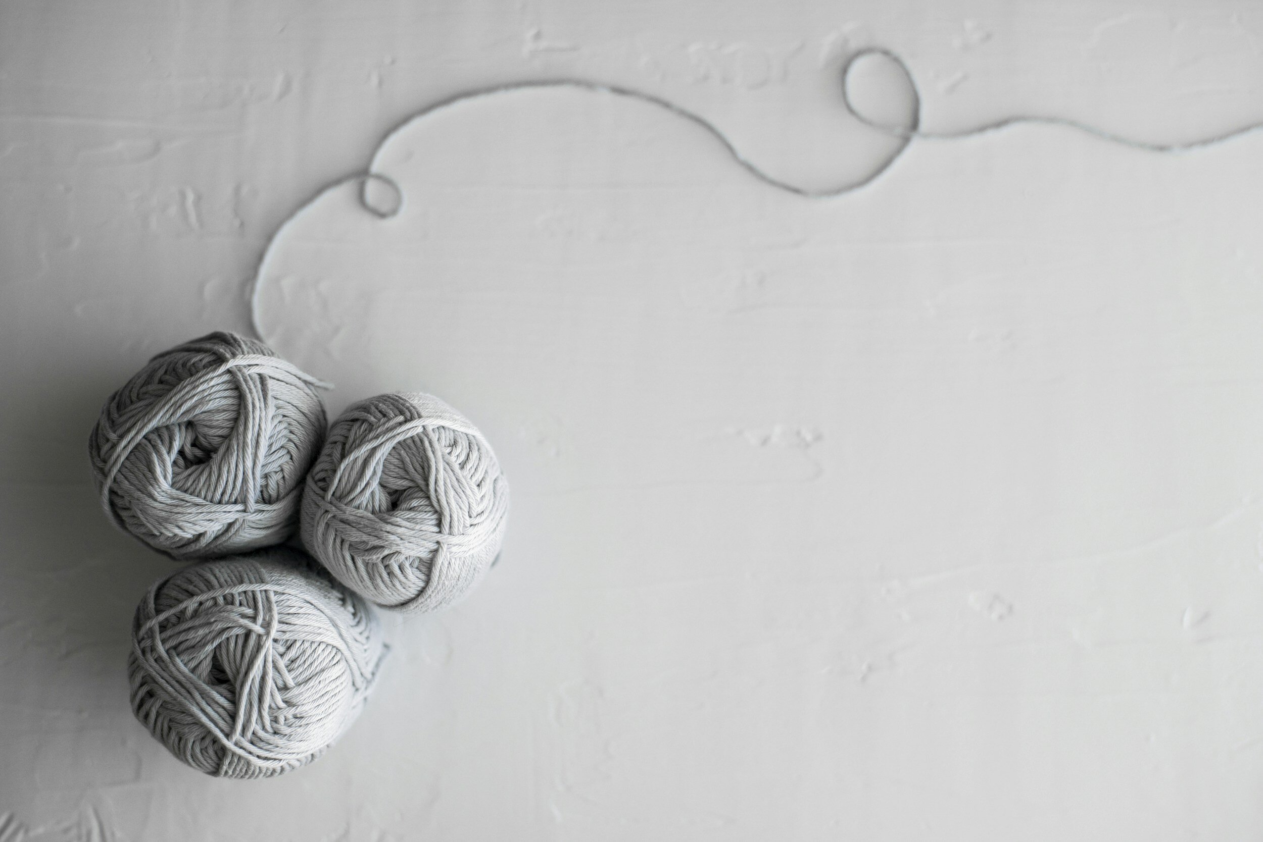 Grey balls of yarn