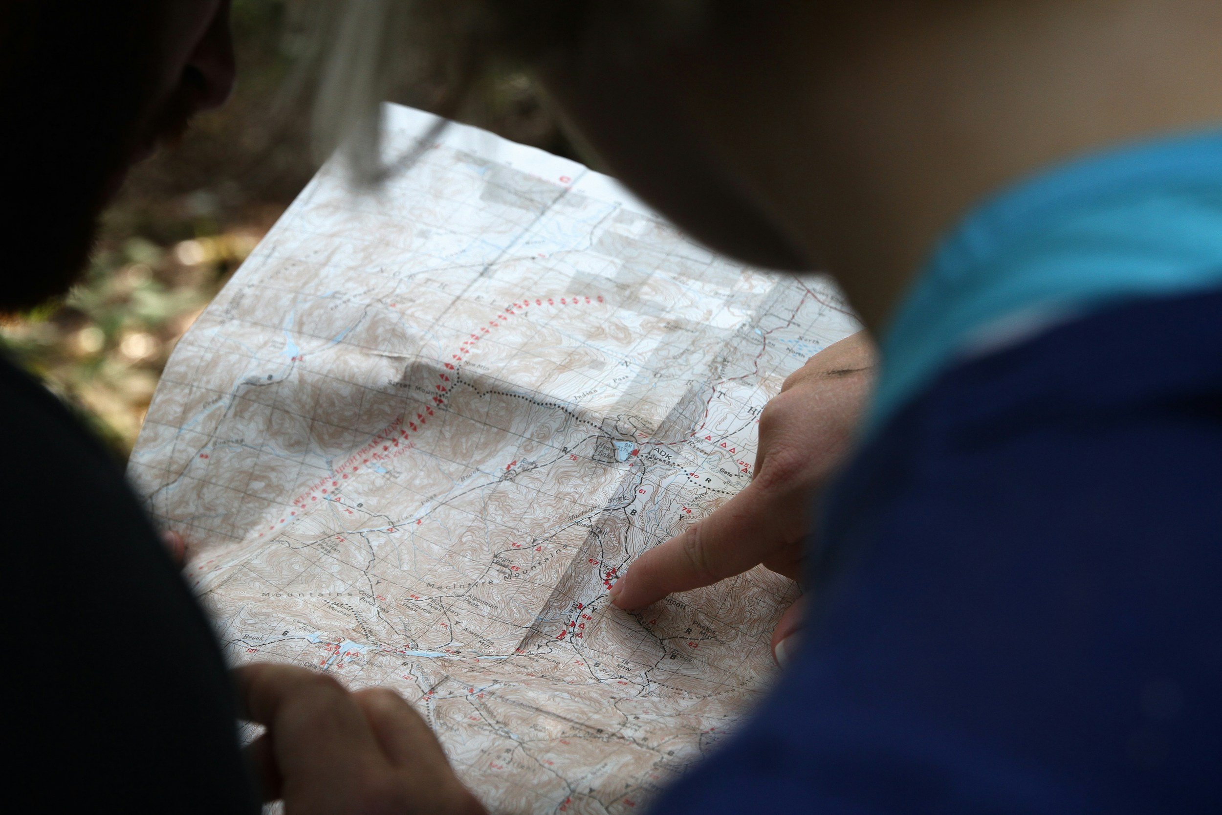 People looking at a trail map