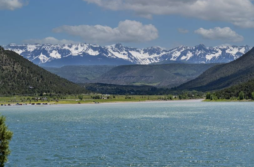 Lake in foreground with mountains in background