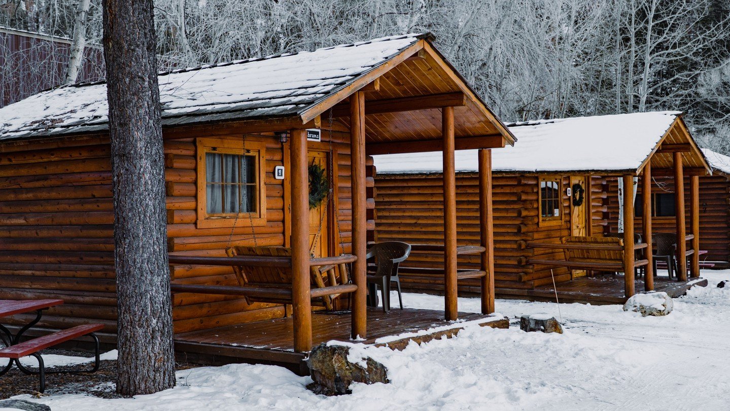 Three log cabins in the snow