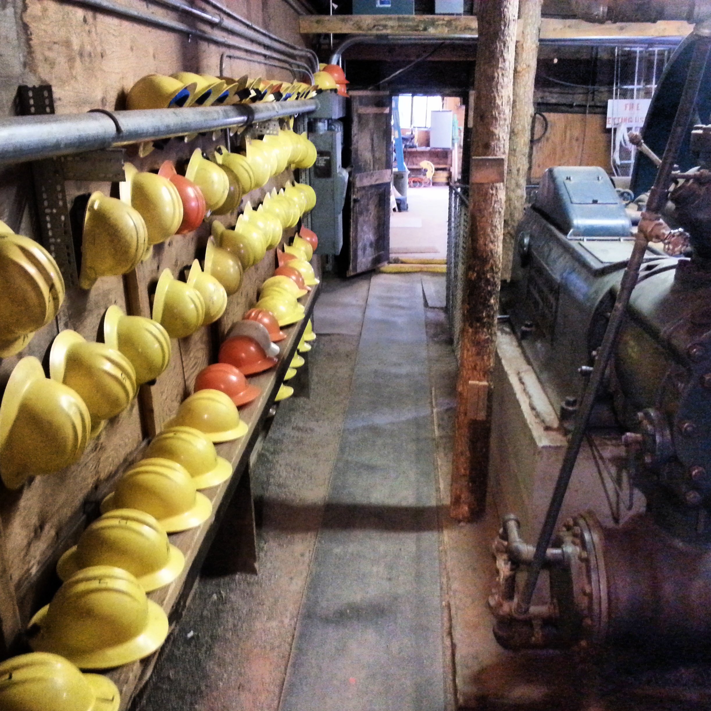 miner hats lined up on wall