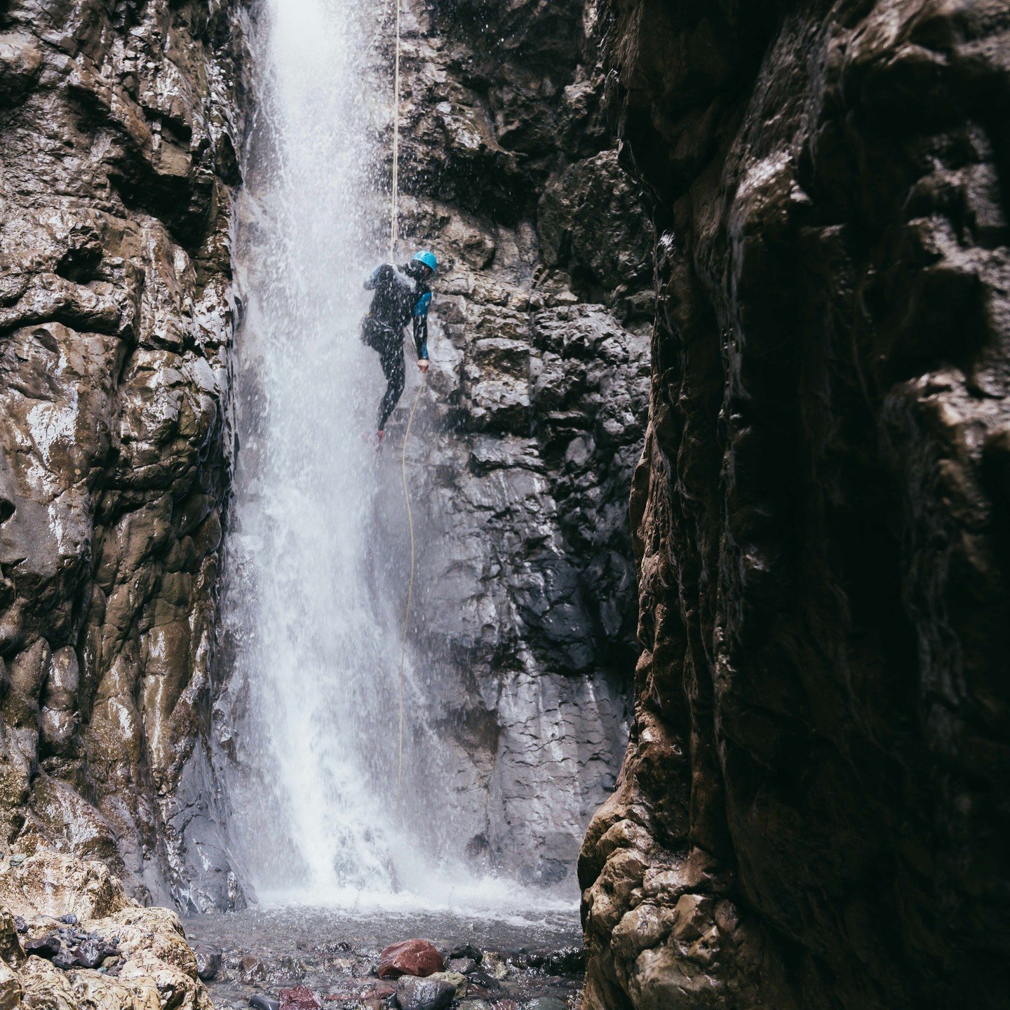 Repelling down a waterfall