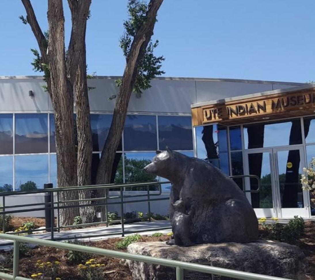 Bear statue with building in background