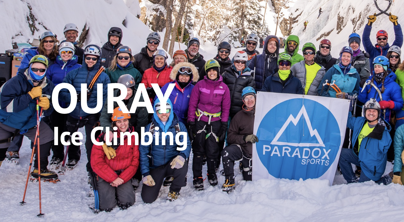 Group of people in Ice Climbing gear posing for picture