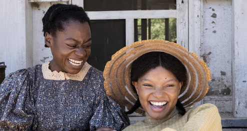 2 ladies in period clothing