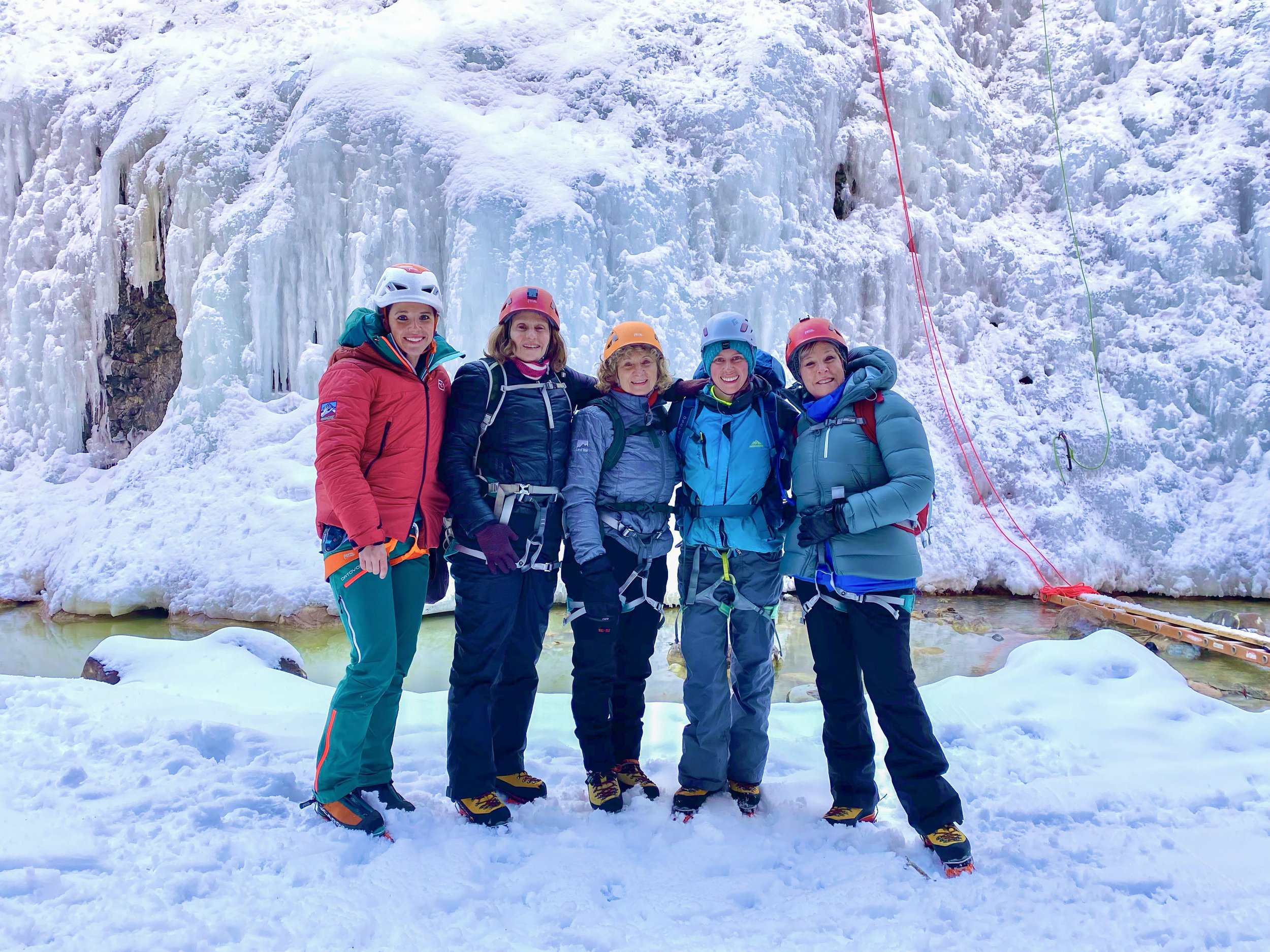 Group of girls ice climbing