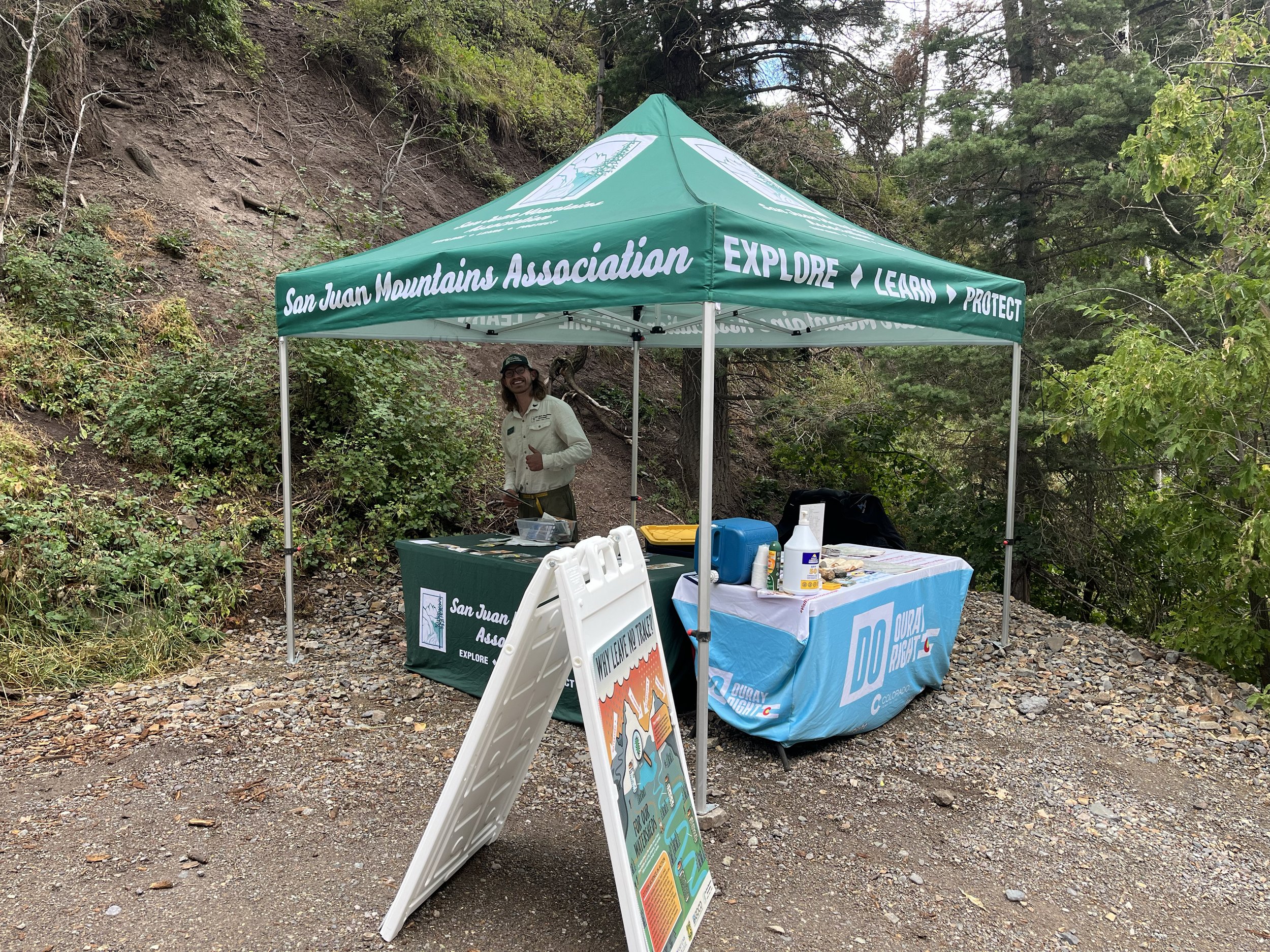 Green tent with guy under it