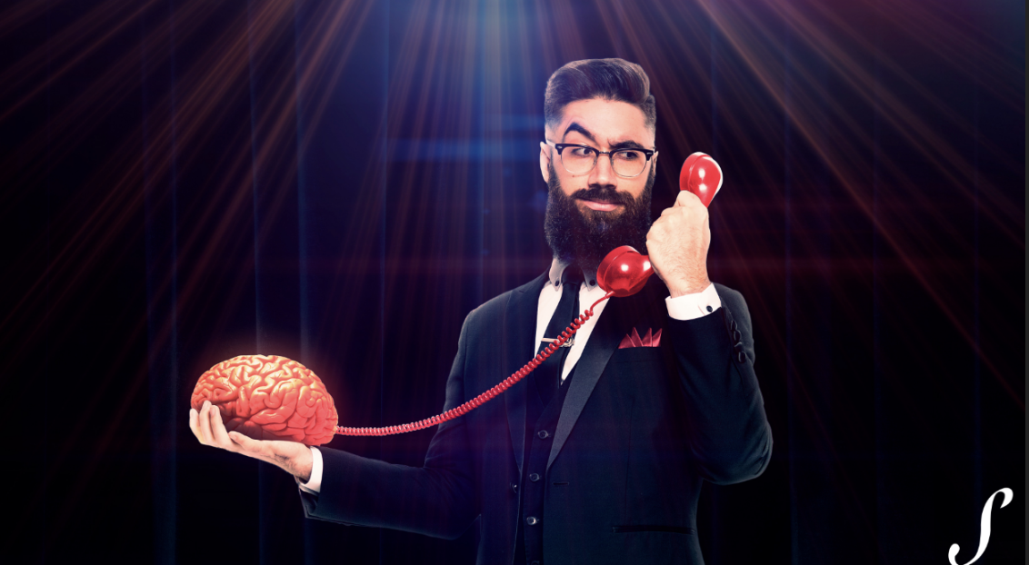 Man holding phone connected to brain