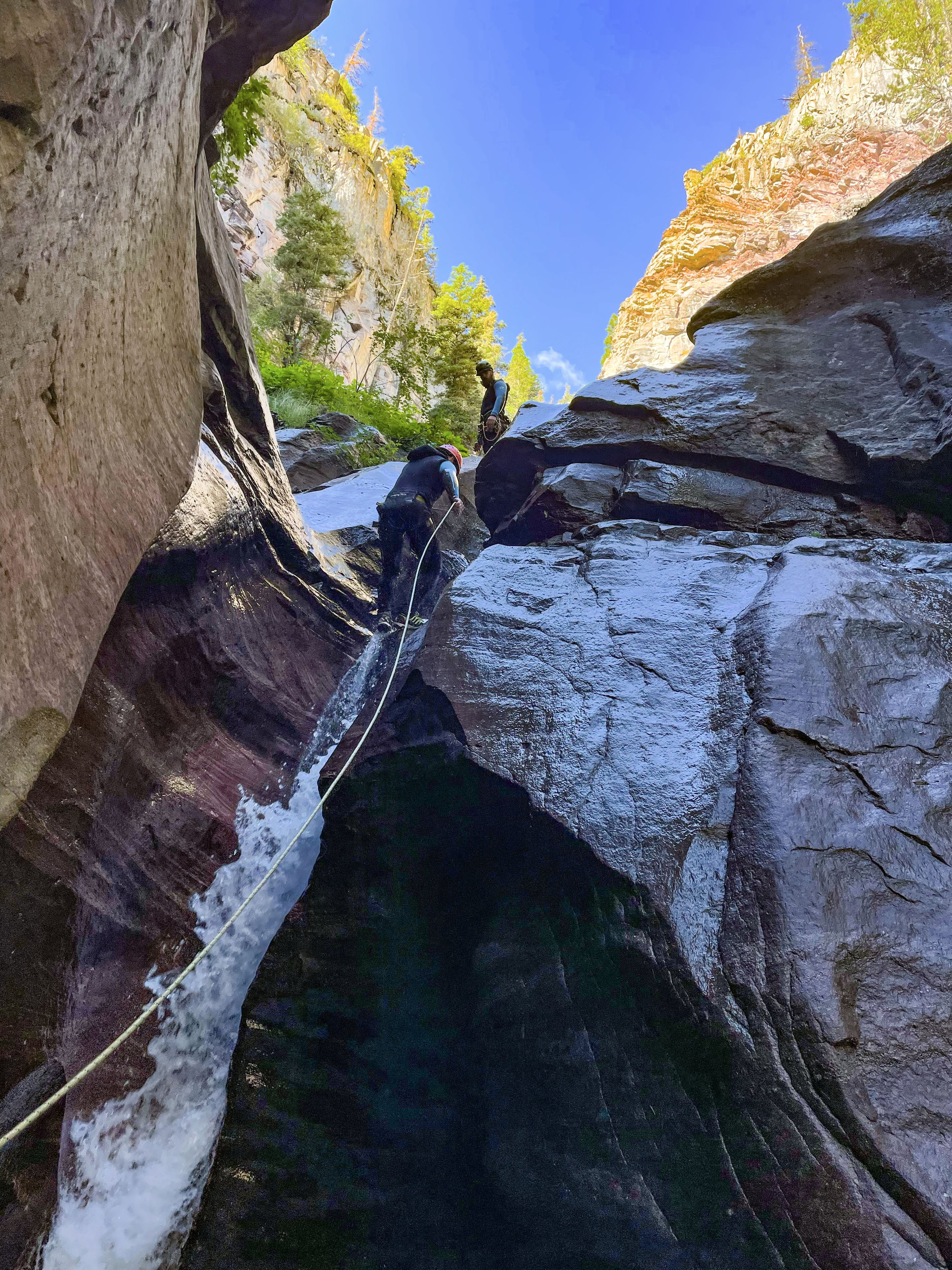 Repelling down slot canyon