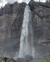 Water falling off of tall cliff