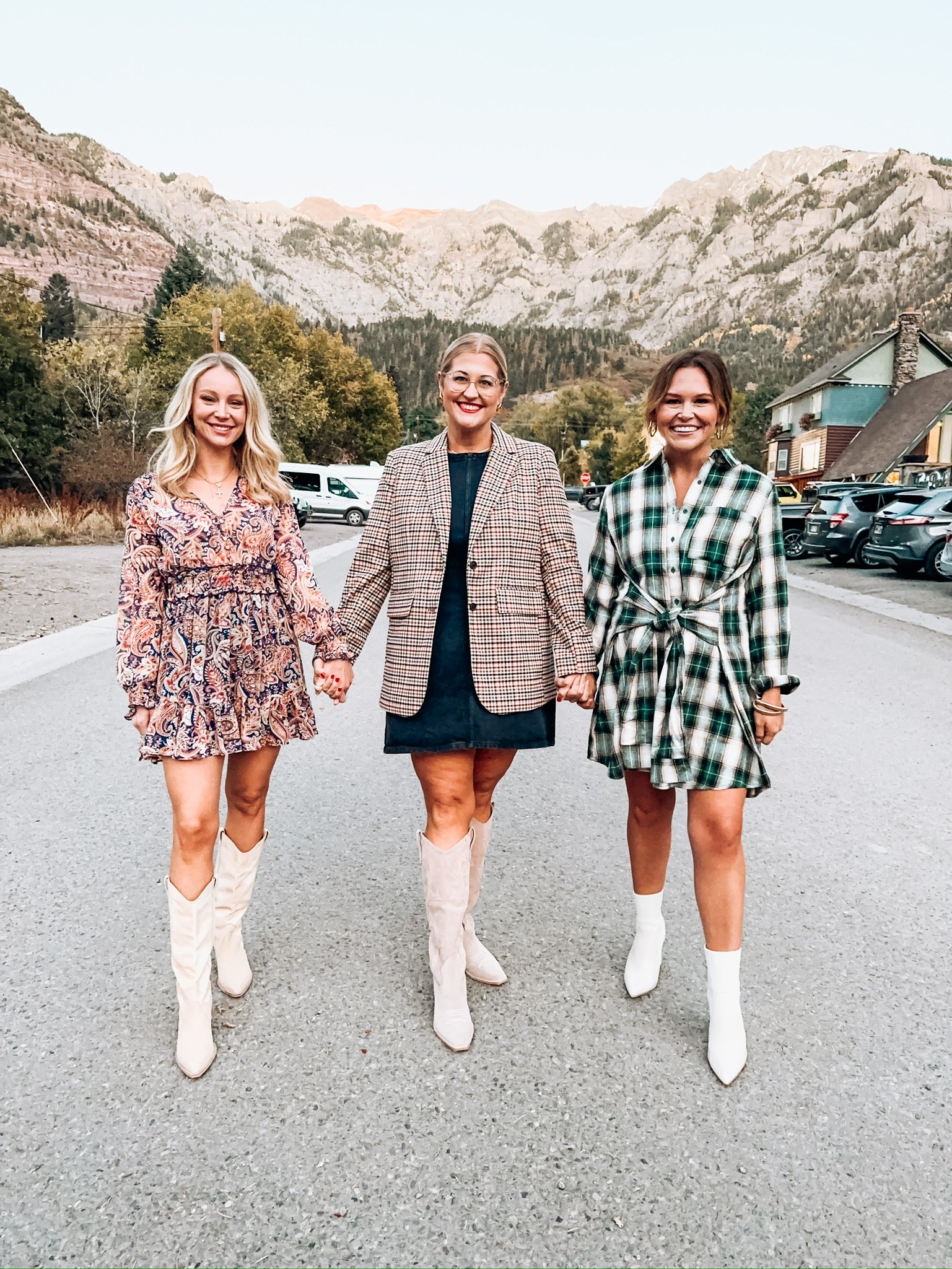 Three girls standing on street