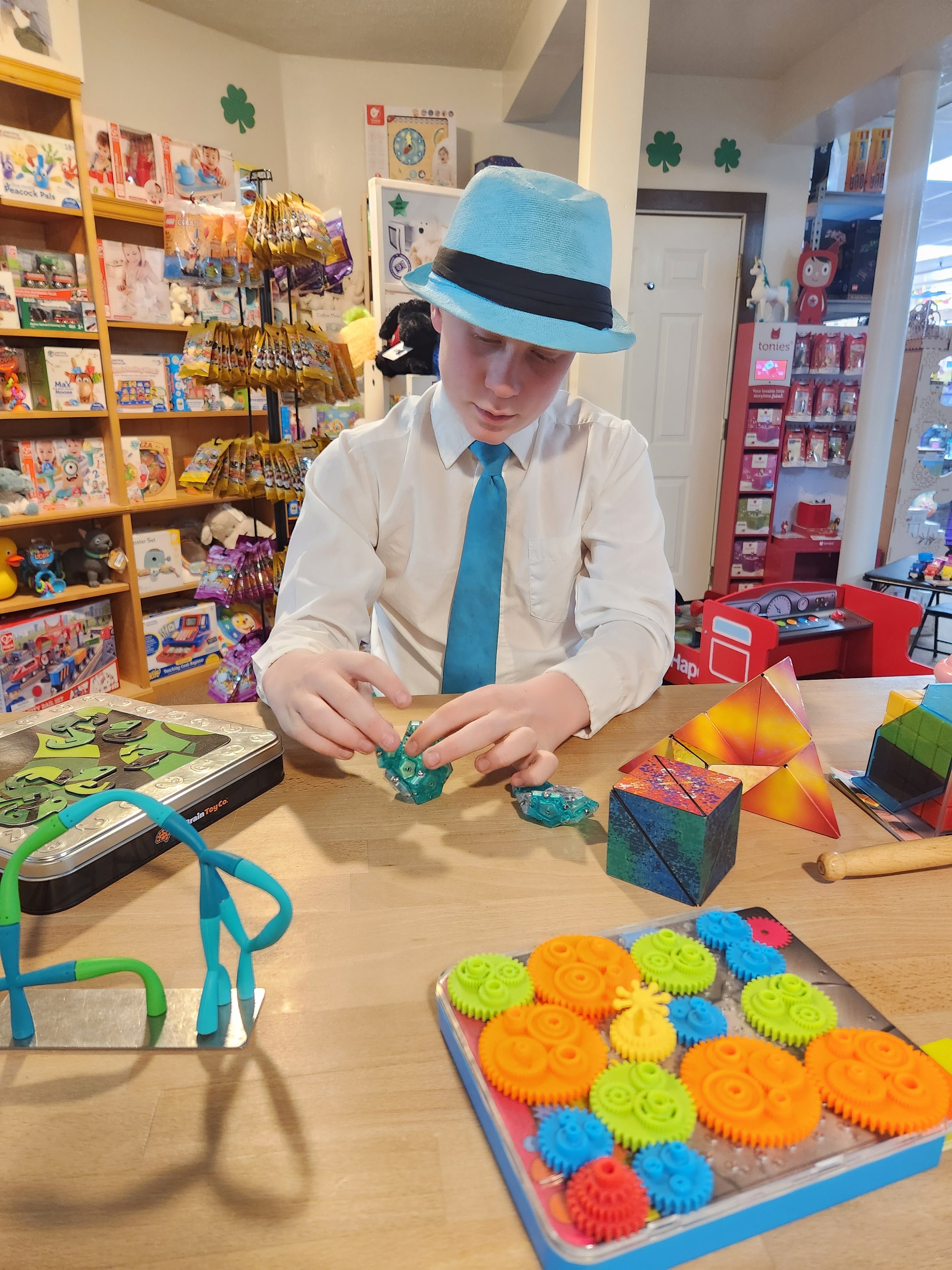Boy playing with toys on desk