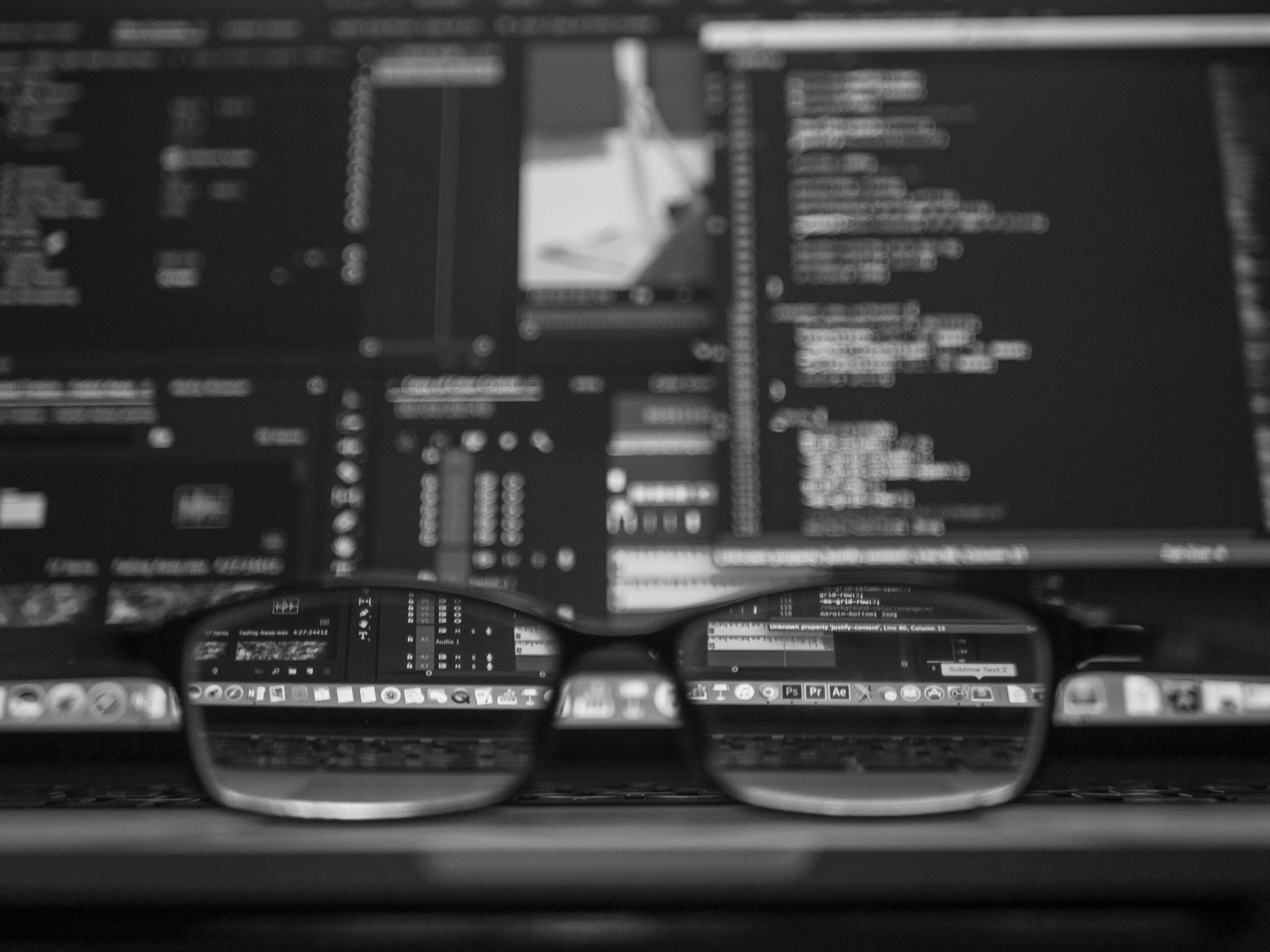 Glasses in front of computers