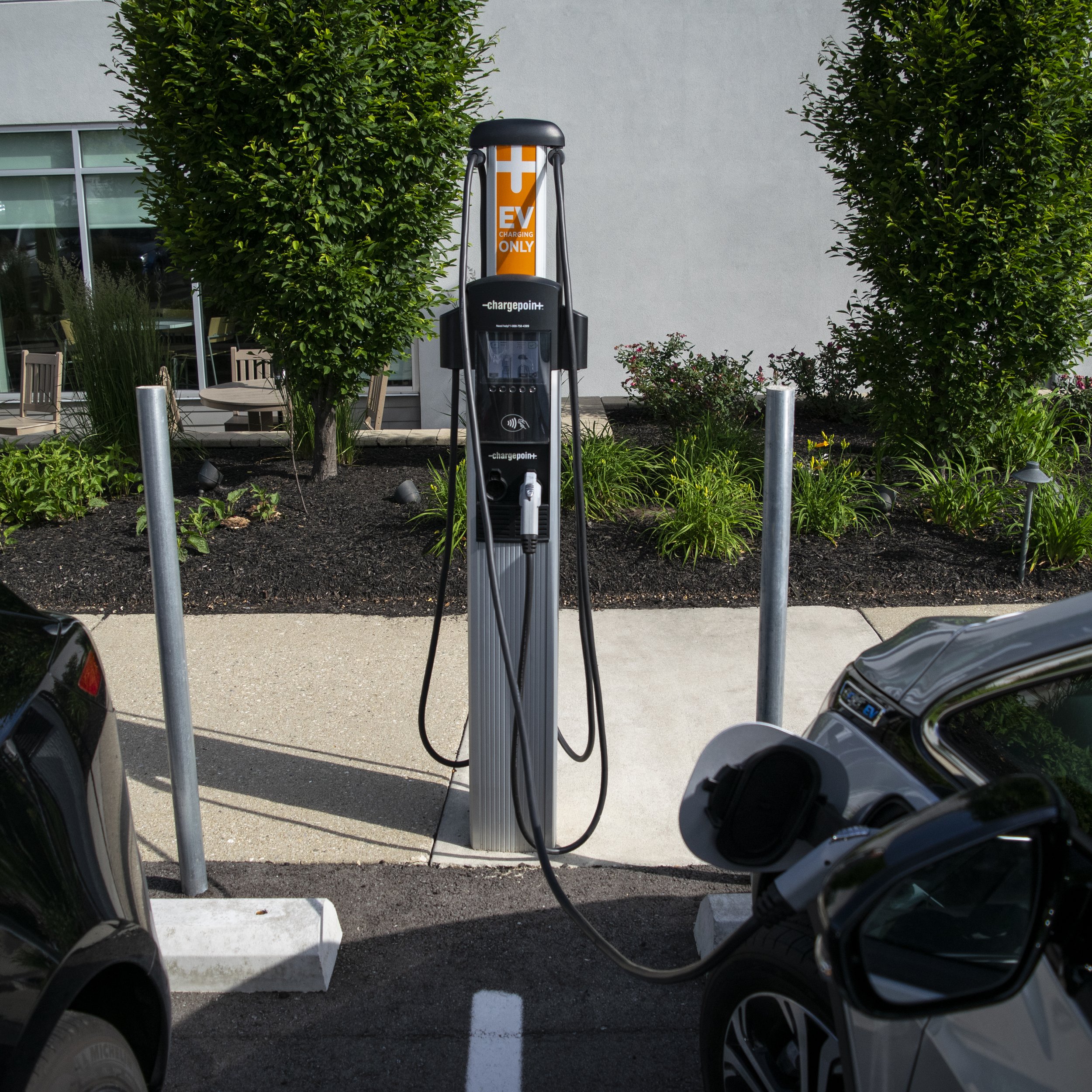 Car charging stanchions for electric vehicles