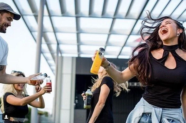 Before Tribal All Day Cafe, Hailey Nutt and Brenton Phillips cold-pressed juice by hand and distributed it to grocery stores. Colorful Tribal Juice is packaged in BPA-free bottles. (@TribalAllDayCafe)