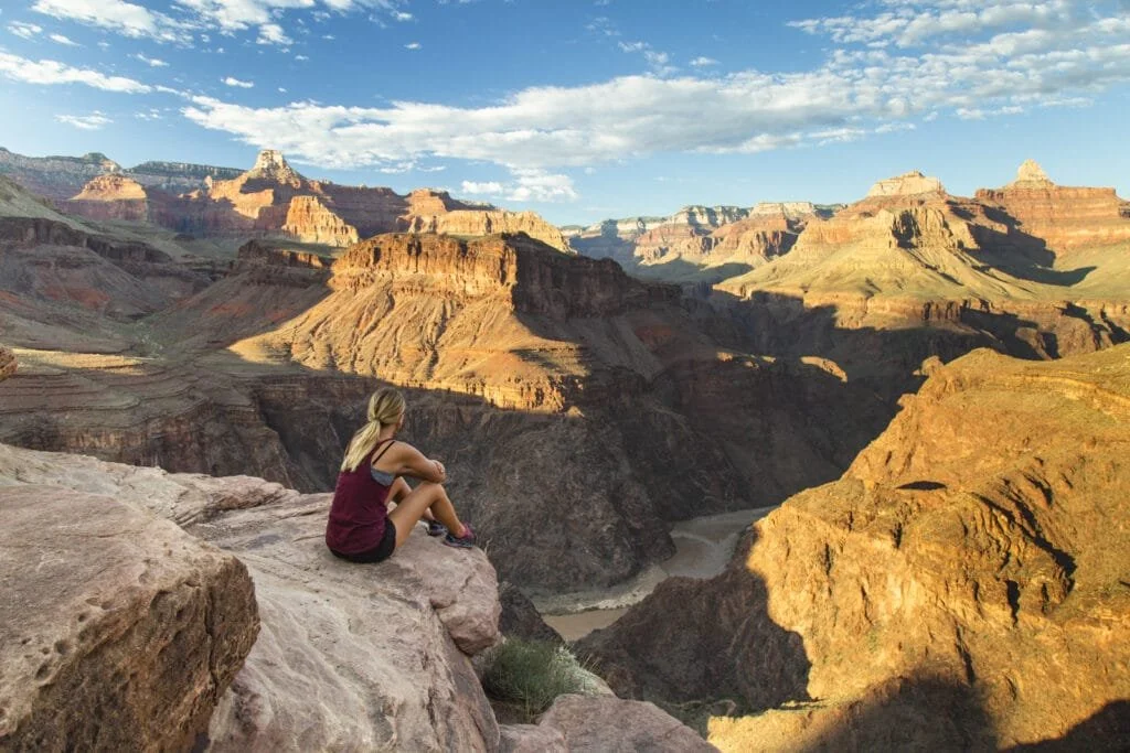 Sitting on the edge of Plateau Point in the Grand Canyon