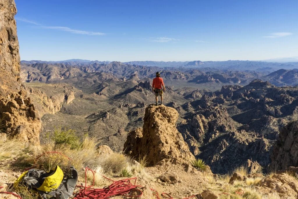 Man standing on the Summit of Weavers Needle