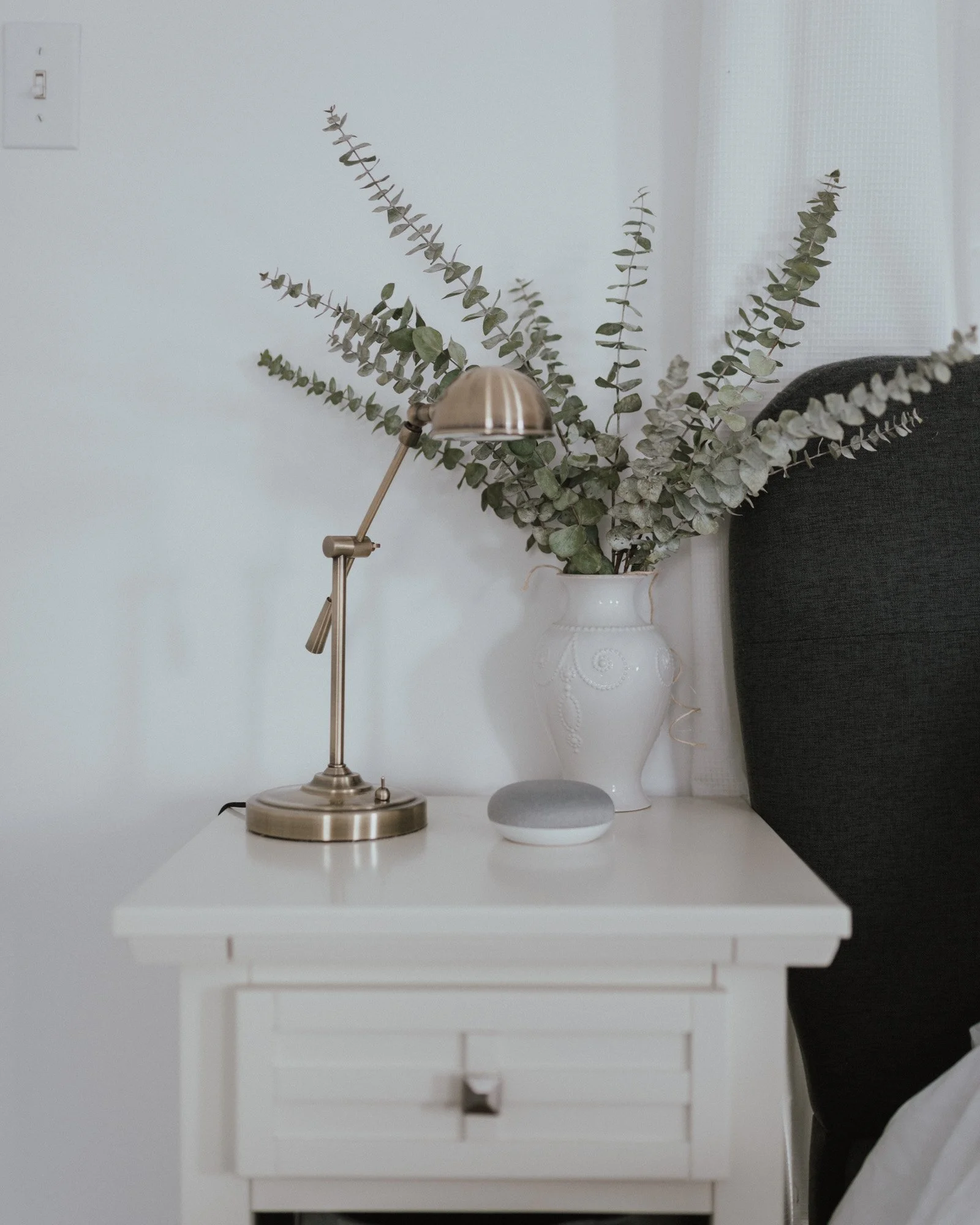The Wild Decoelis | Master Bedroom Update | white nightstand from Bed bath and beyond with pharmacy light