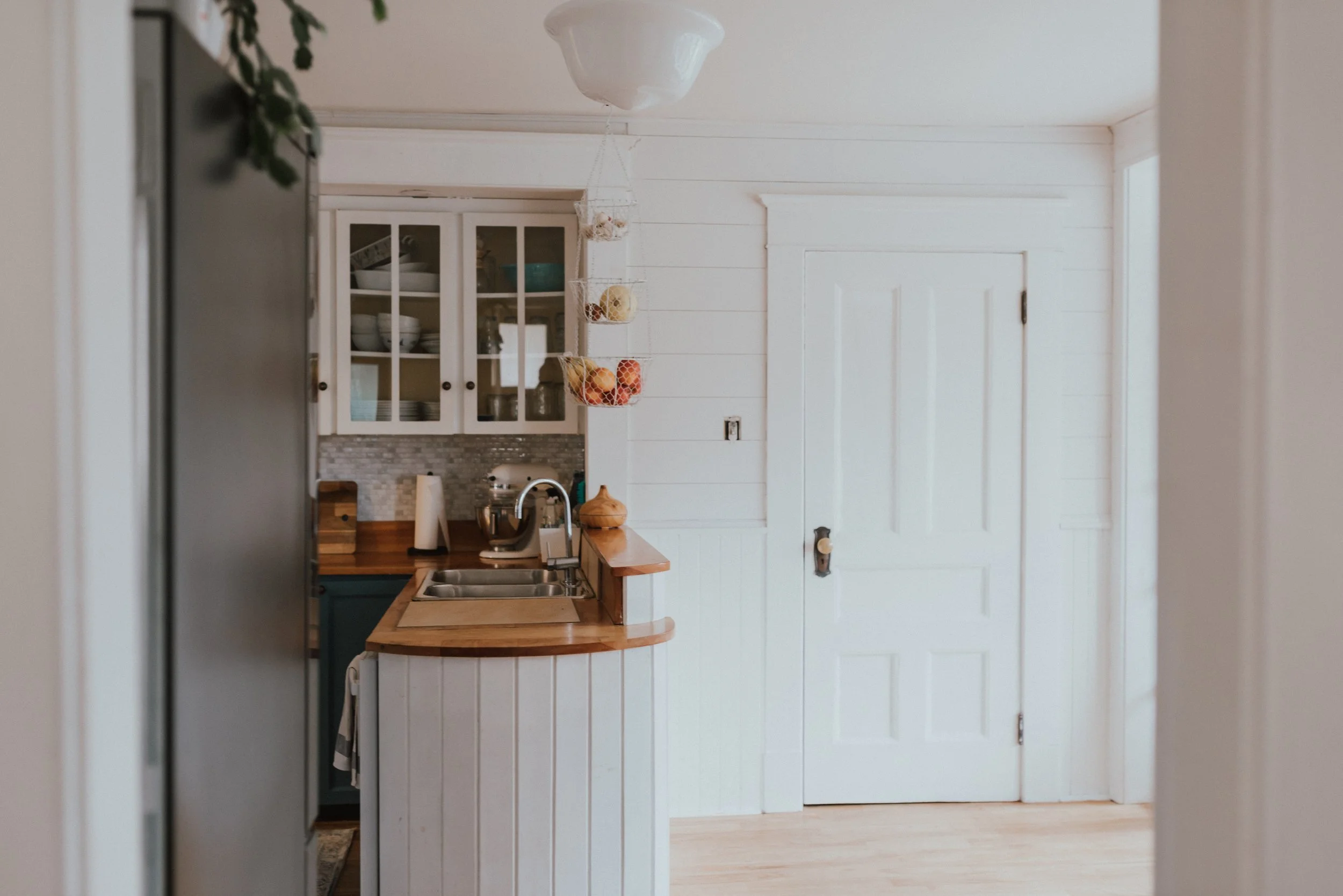 The Wild Decoelis | How We Transformed Our Kitchen For Under $1500 | after | shiplap and wainscotting walls