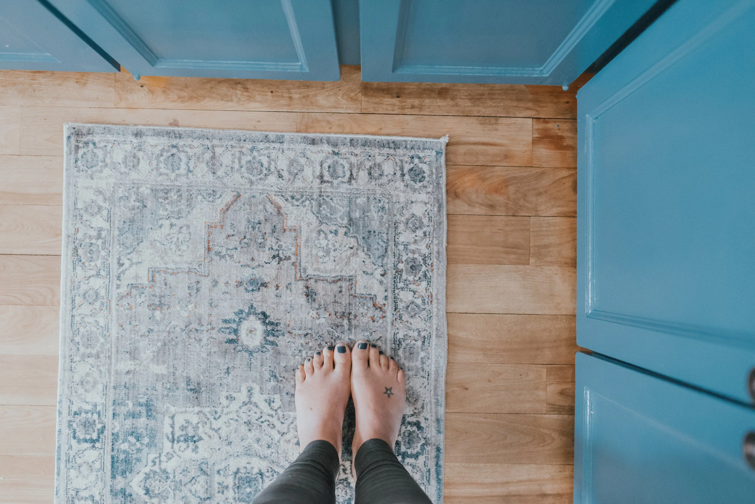The Wild Decoelis | How We Transformed Our Kitchen For Under $1500 | after | kitchen runner to warm up the space. 