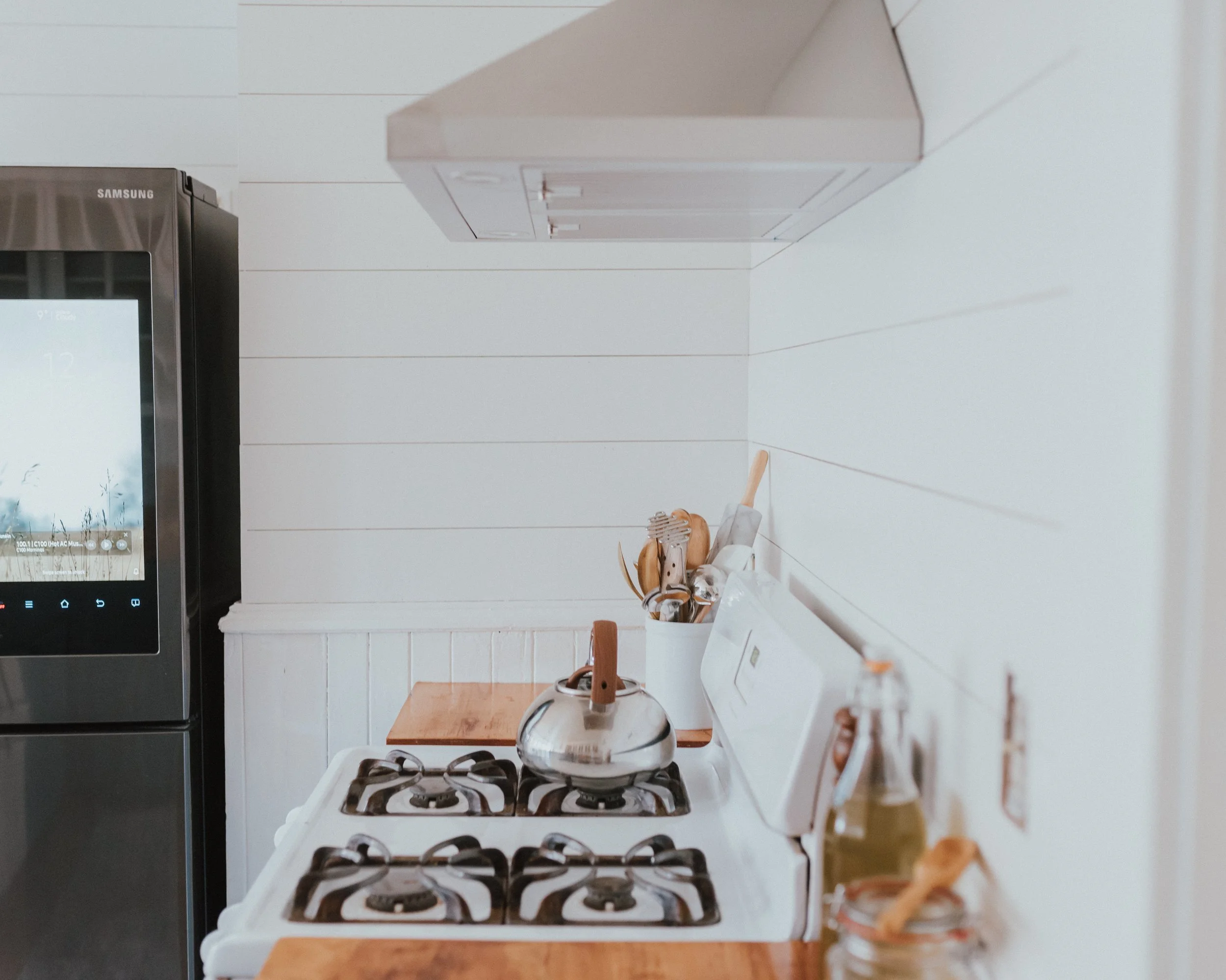 The Wild Decoelis | How We Transformed Our Kitchen For Under $1500 | after | Range hood in stainless steel