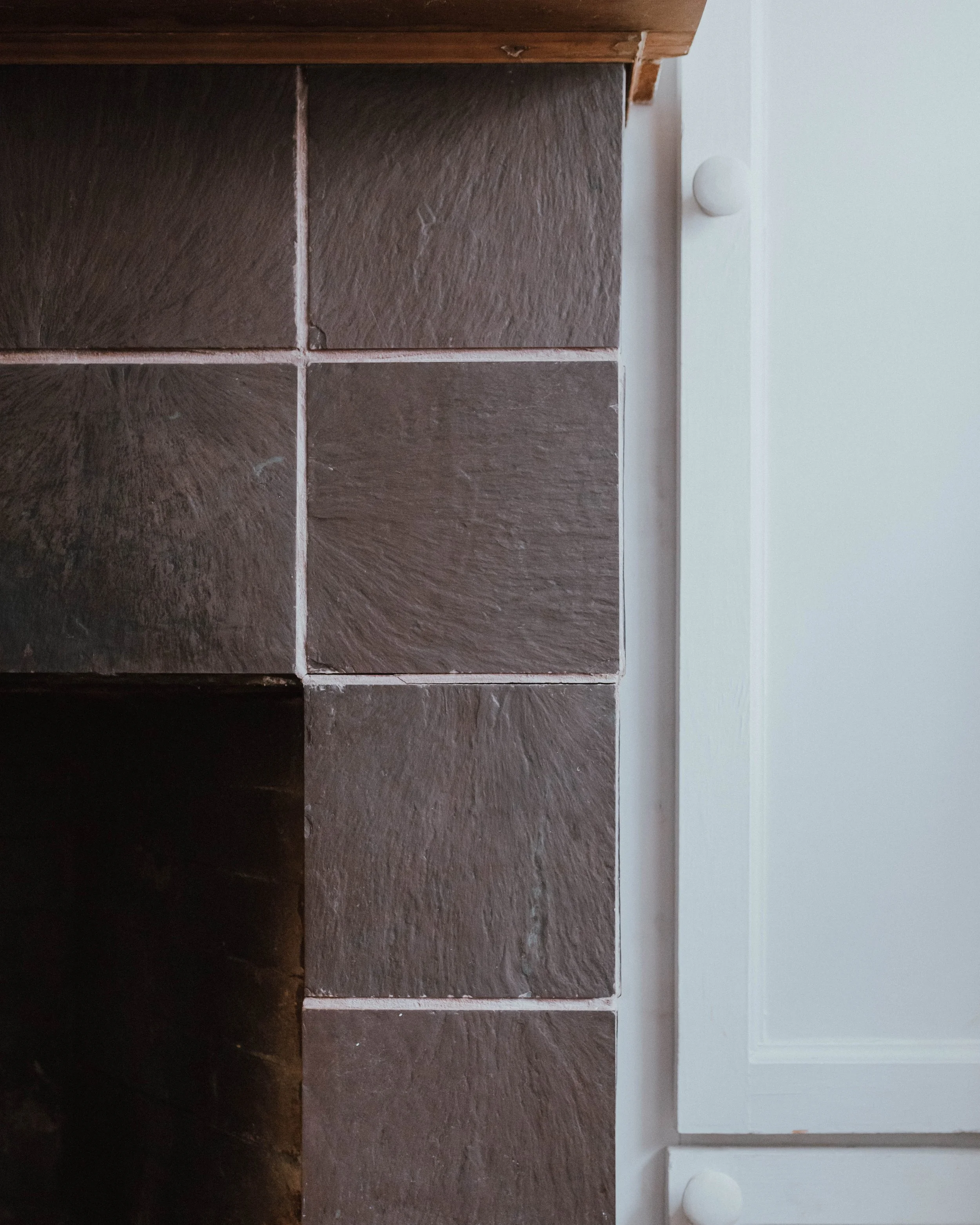 My $100 Fireplace Makeover with Behr Paint | The Wild Decoelis | tired, dirty tile