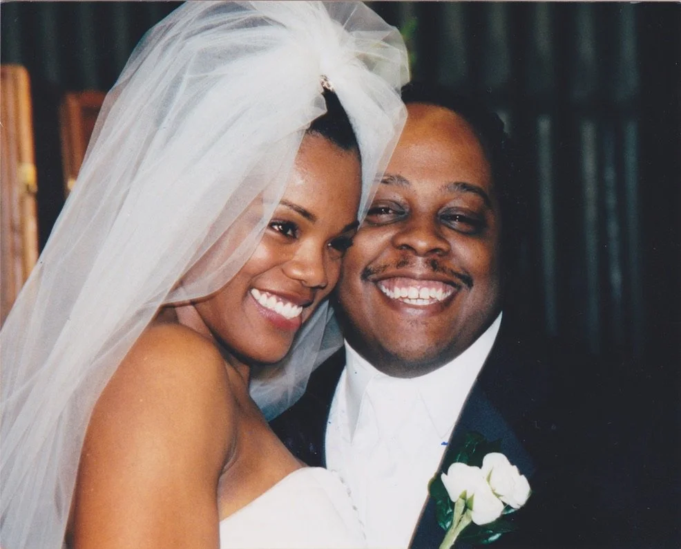 Roz and Craig smiling together on their wedding day