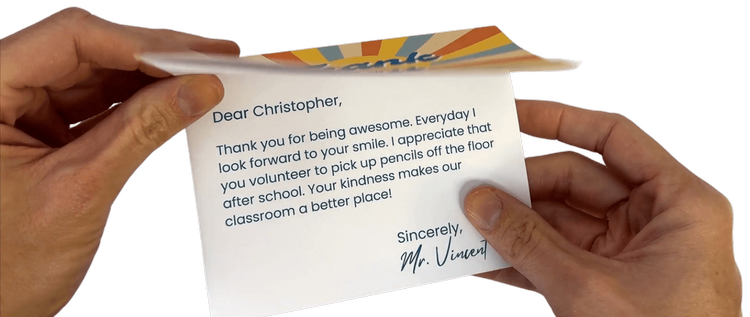 Photo of hands opening a thank you card