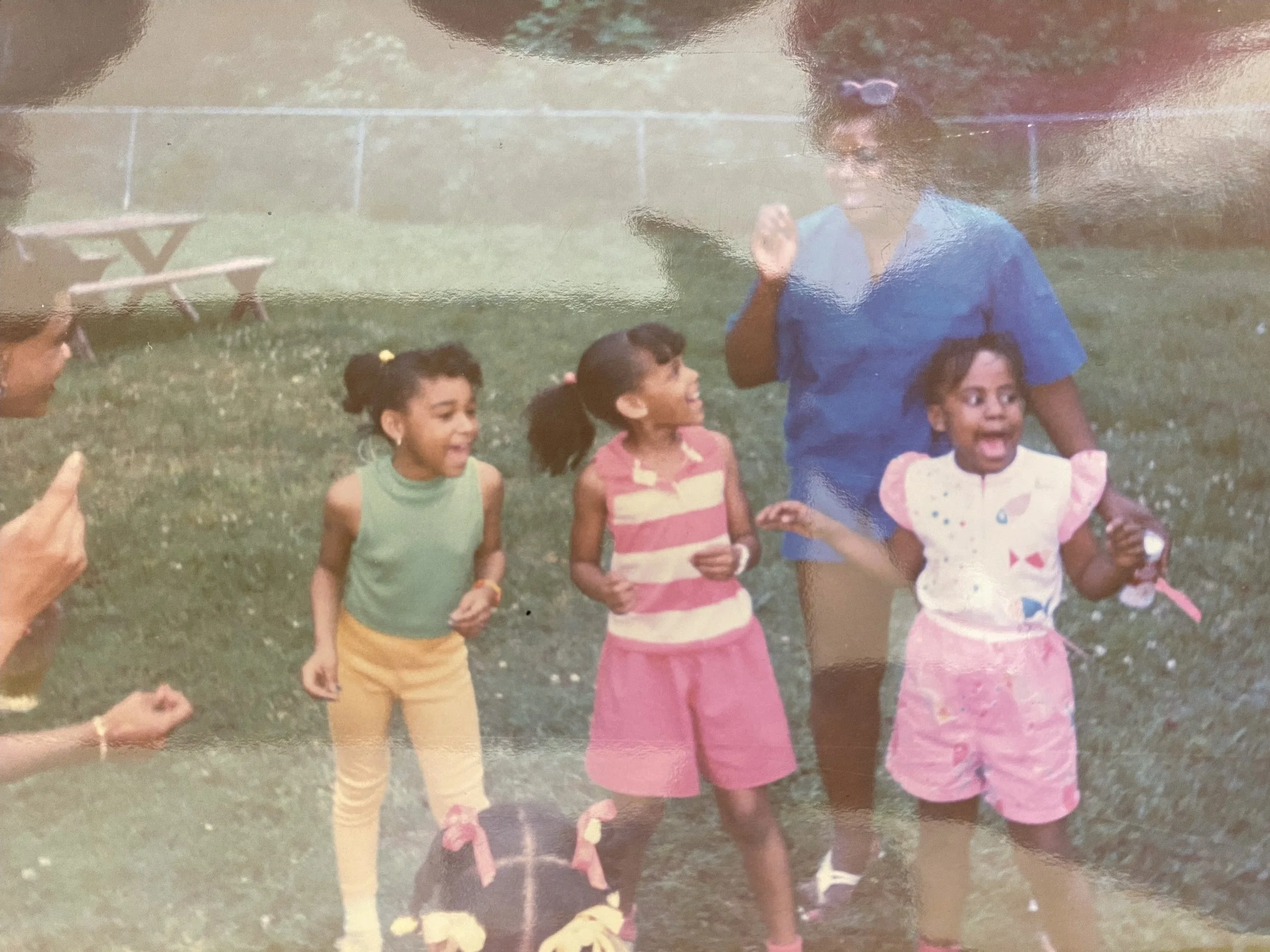 Kids laughing and playing at a backyard gathering