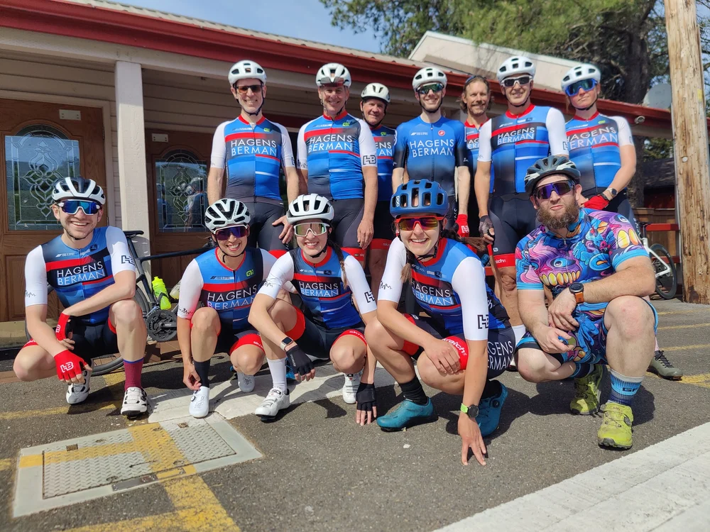 The team on a group ride stop