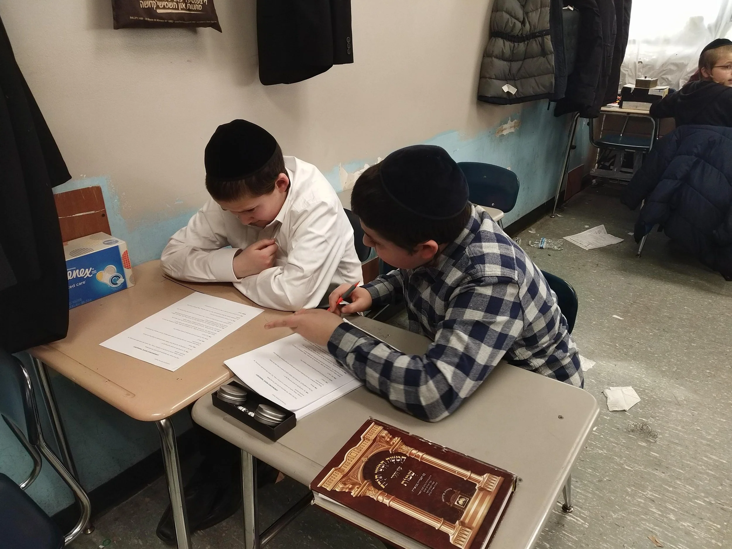 Students reviewing their typed pieces together