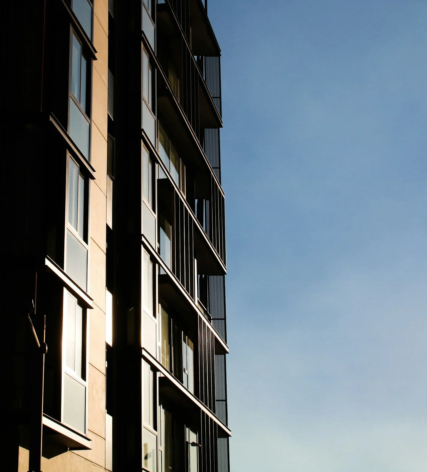 Residential building facade against a blue sky