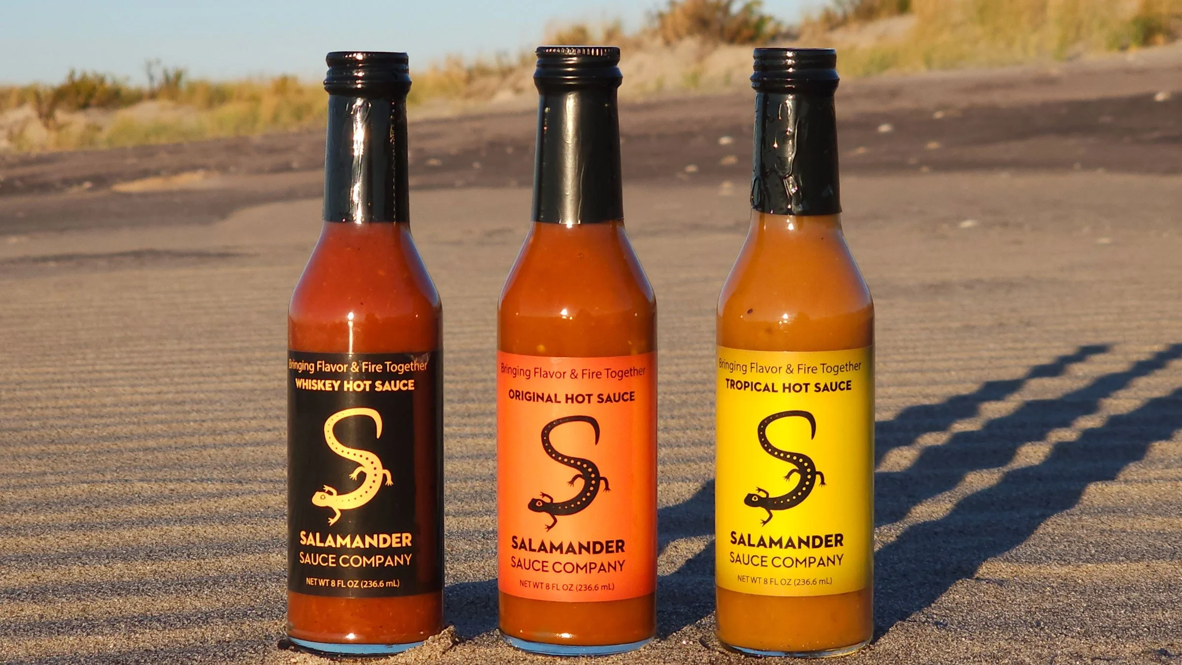Salamander Hot Sauce bottles in nature