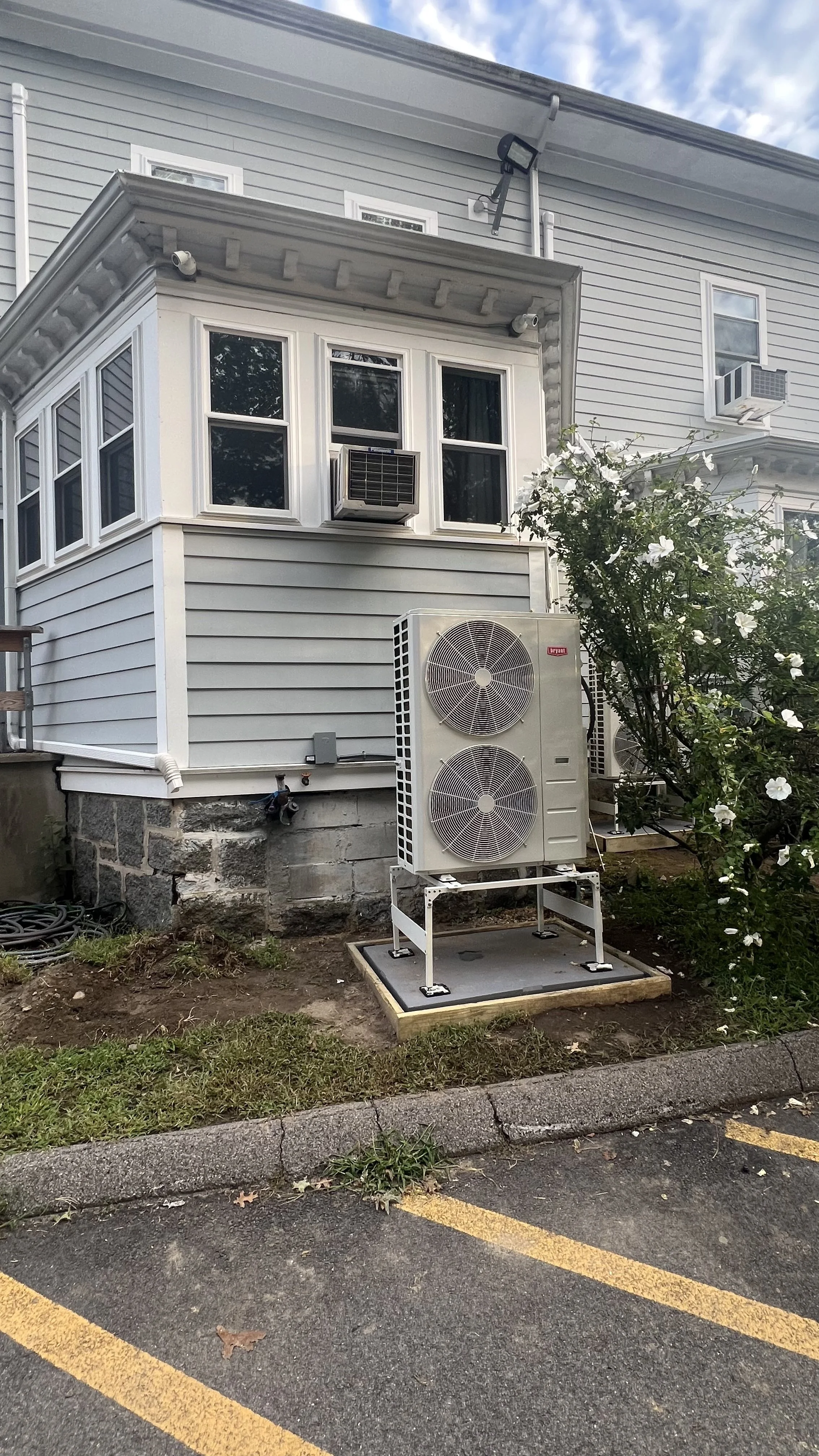 High-efficiency heat pump unit installed outside Temple HBT's classroom and office building