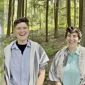 Rabbi Aliza and Eliana Golding smiling together outdoors