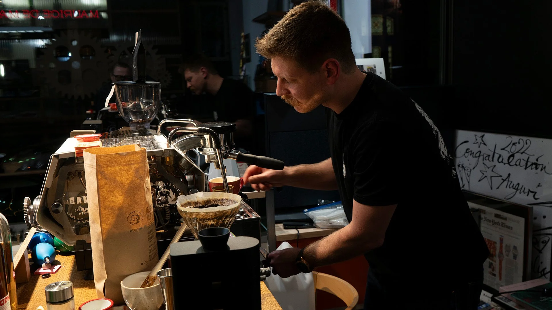 Sandro pulling an espresso behind the bar at a guest shift at Maurice de Mauriac