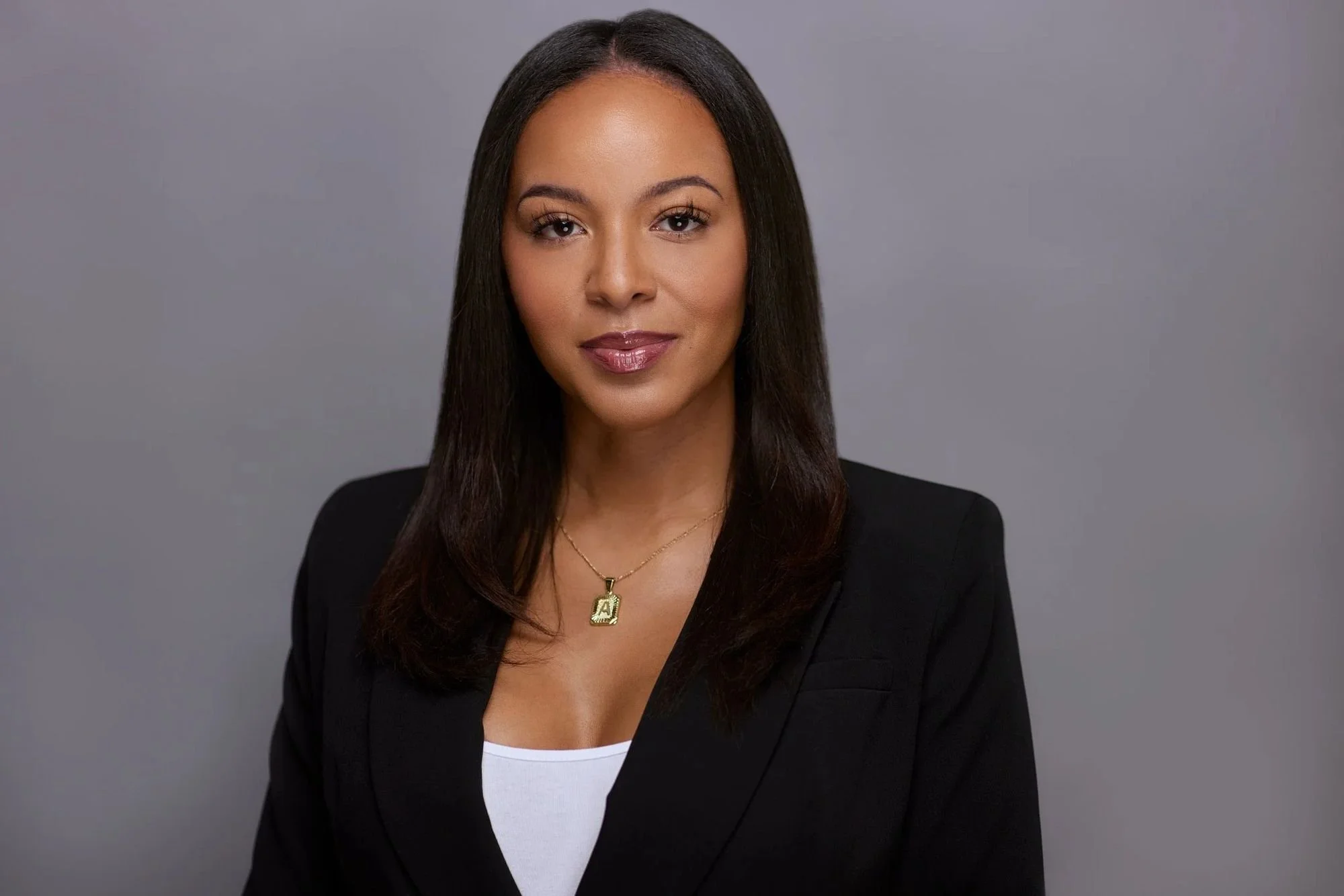 Professional headshot on a gray backdrop