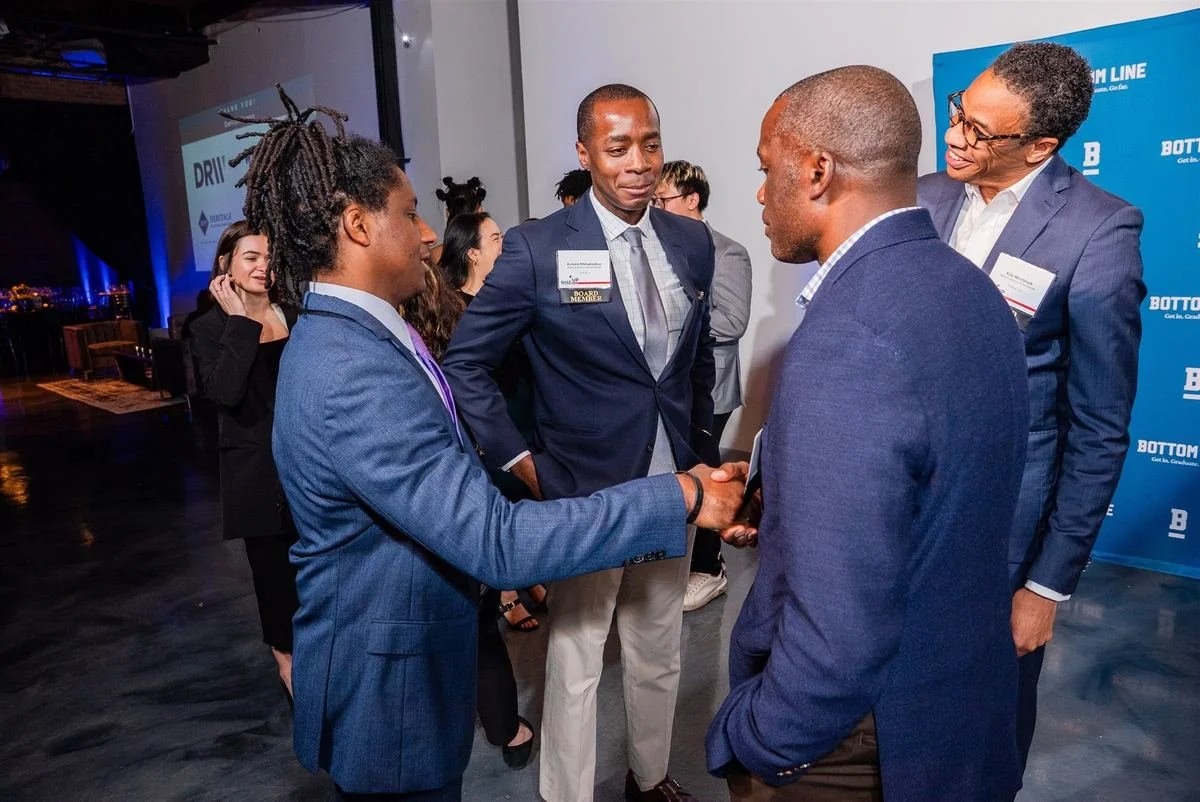 Two guests shaking hands