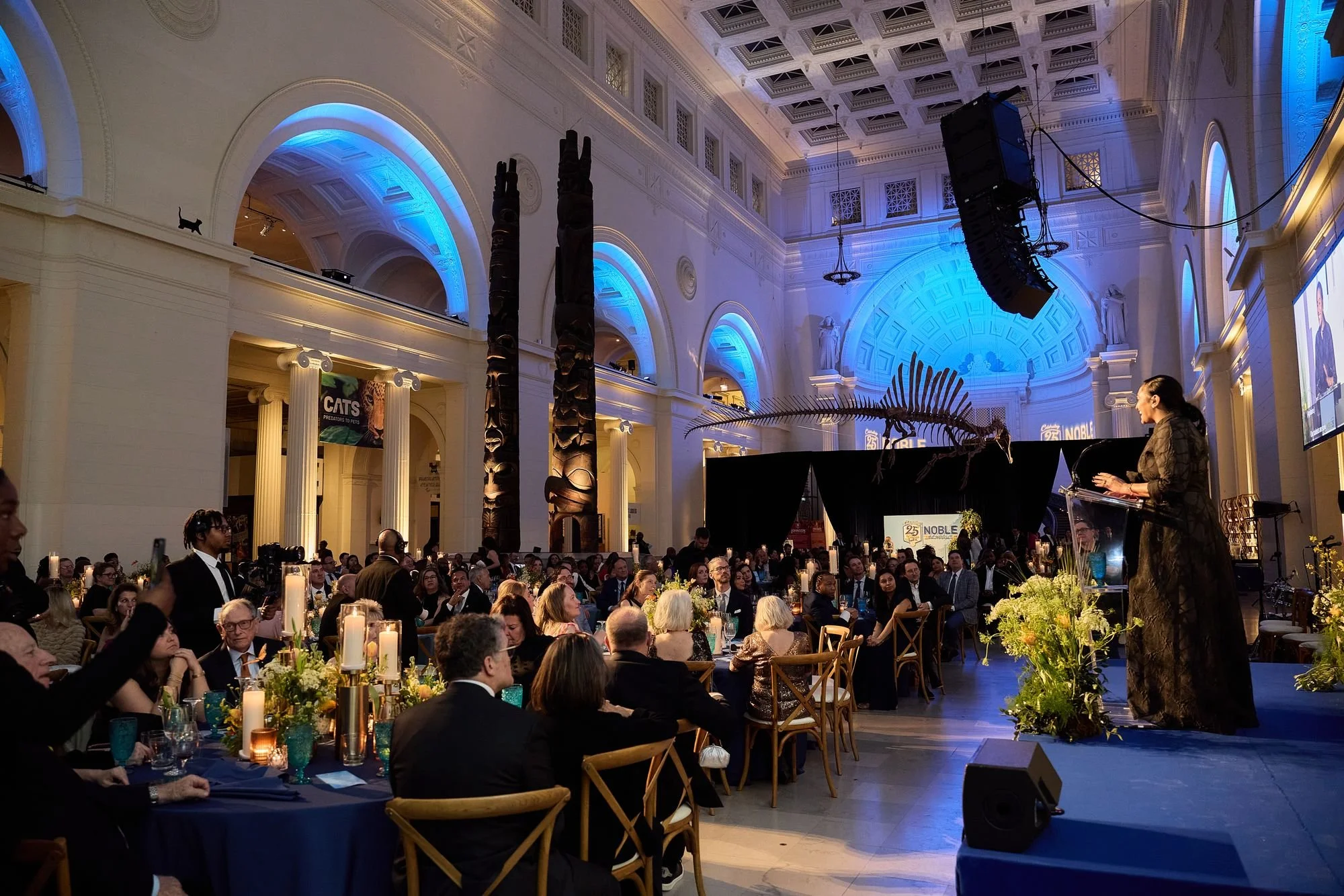 Guests at tables in a grand hall