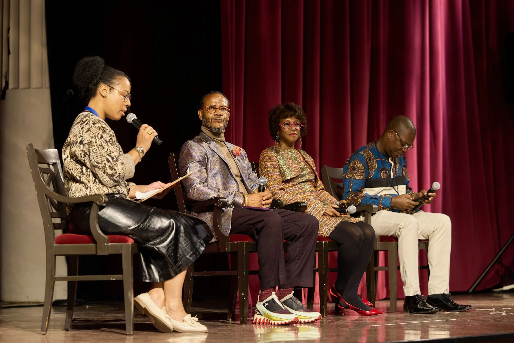 Seated panel in front of an audience
