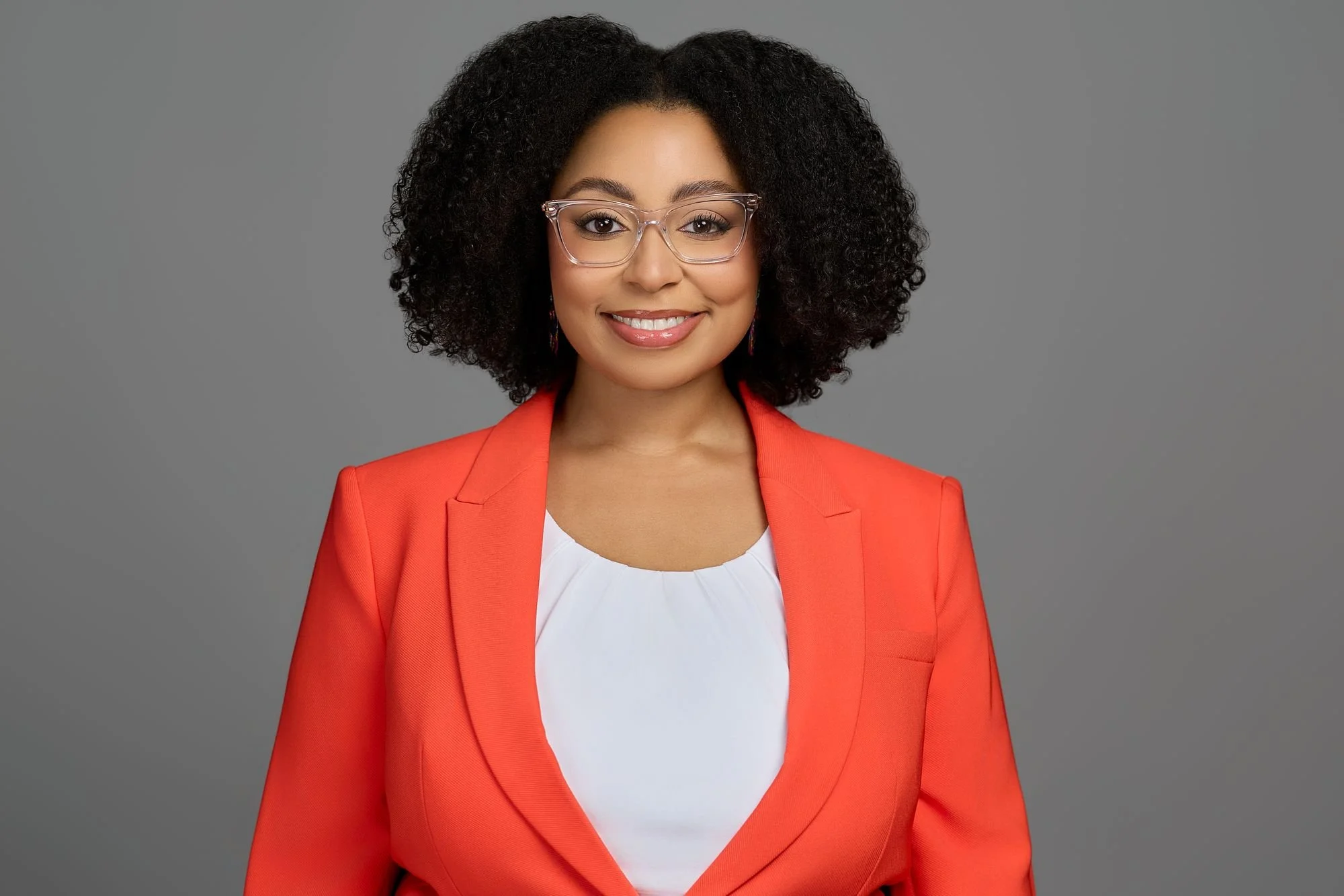 Professional headshot on a gray backdrop
