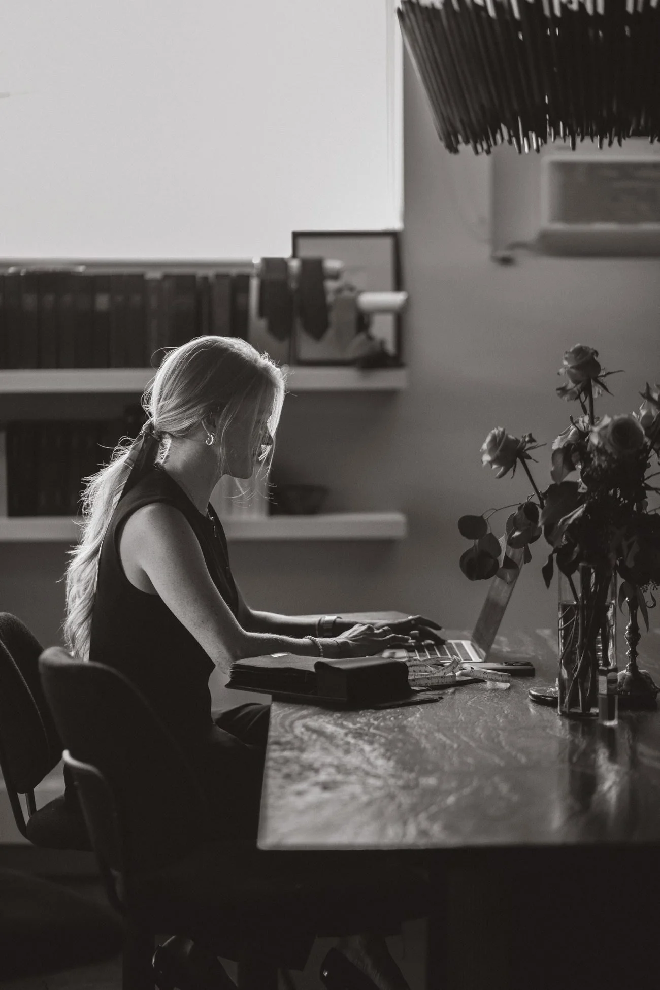 Lauren Larsen at her desk reviewing a client's online profile