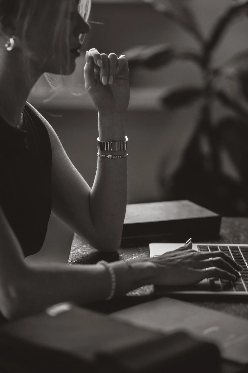 Lauren planning a client's wardrobe at her desk