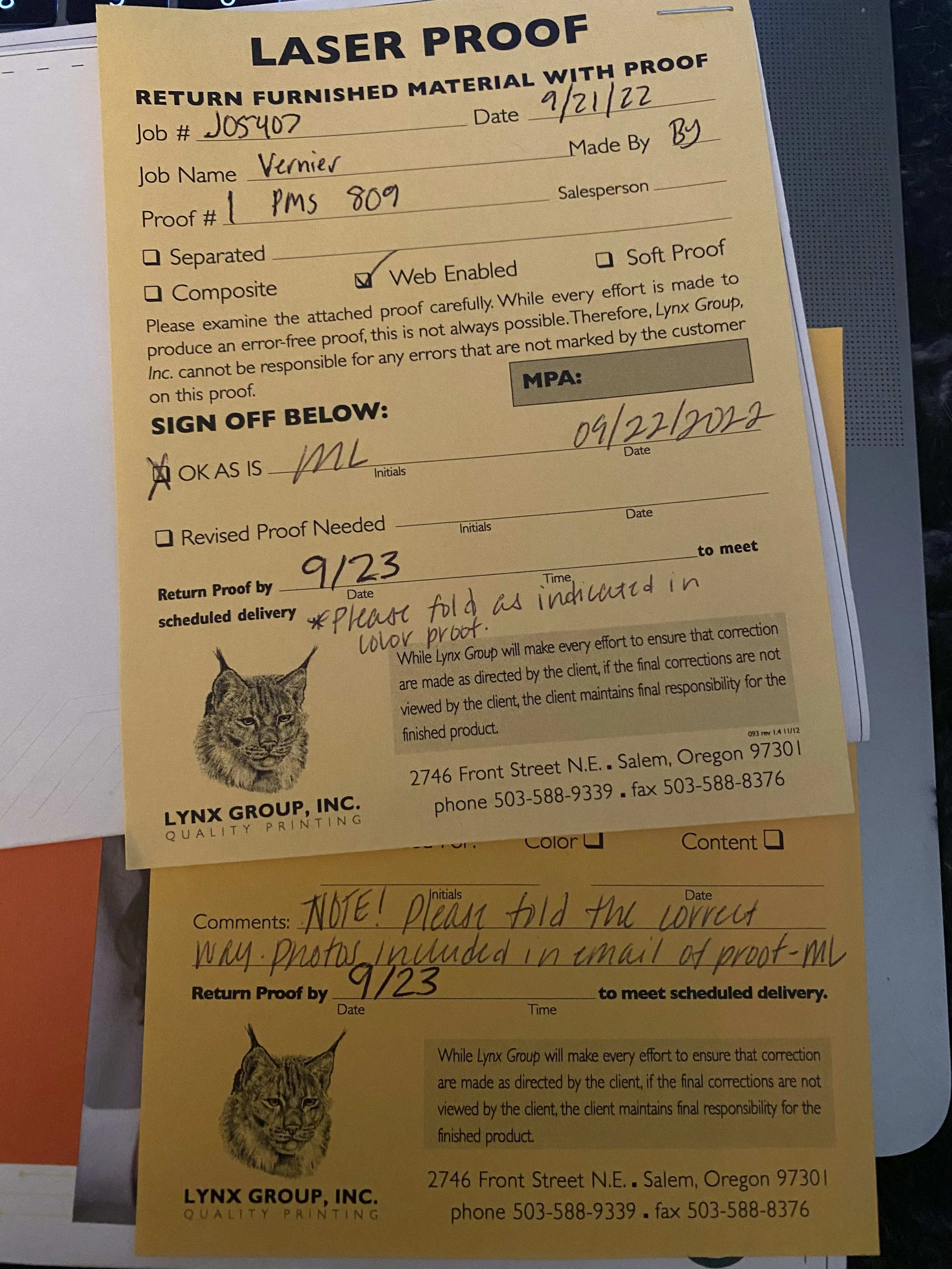 Marked-up print proof with correction notes
