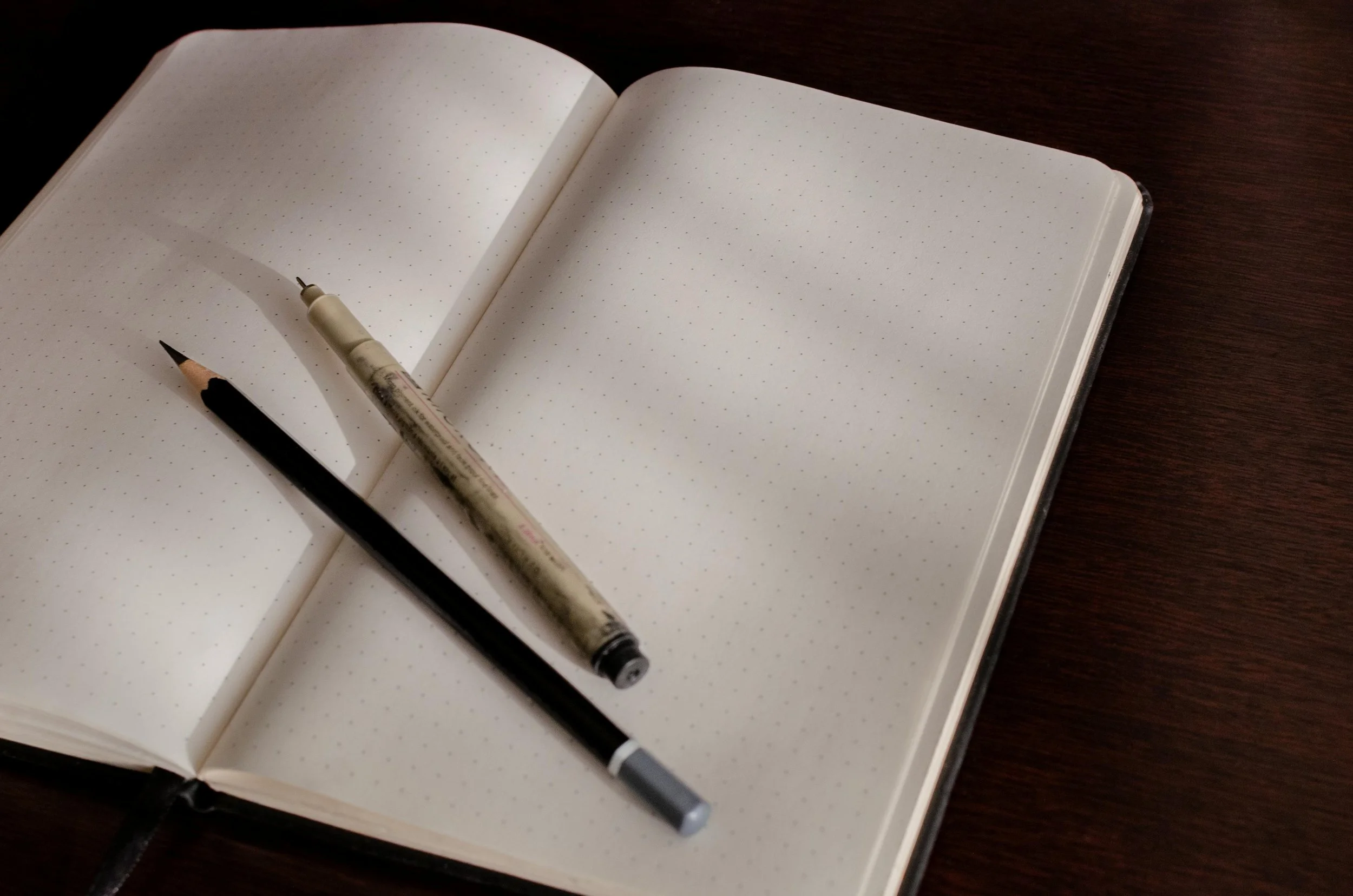 Sketchbook detail, blank page with pens