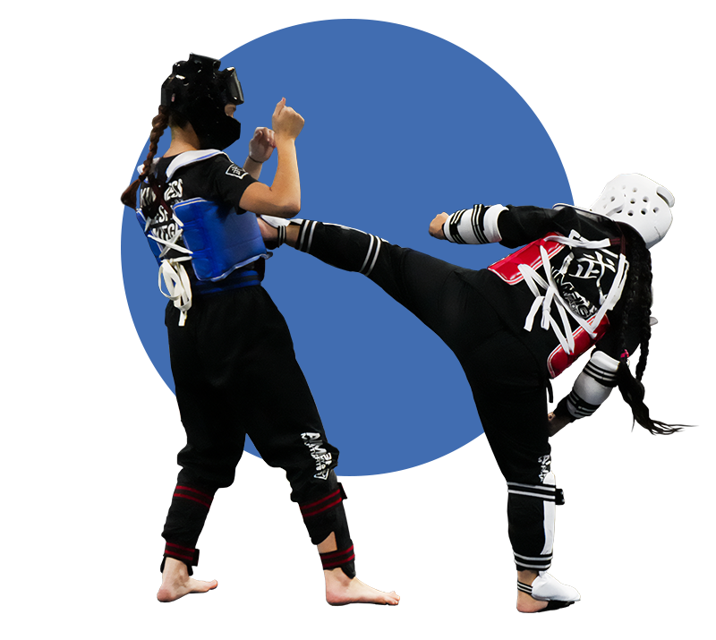 A Taekwondo student lands a kick during sparring practice.